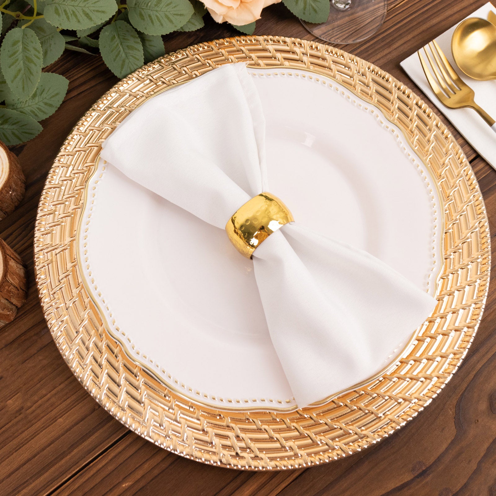 Metallic gold swirl rattan acrylic charger plate on a wooden table.