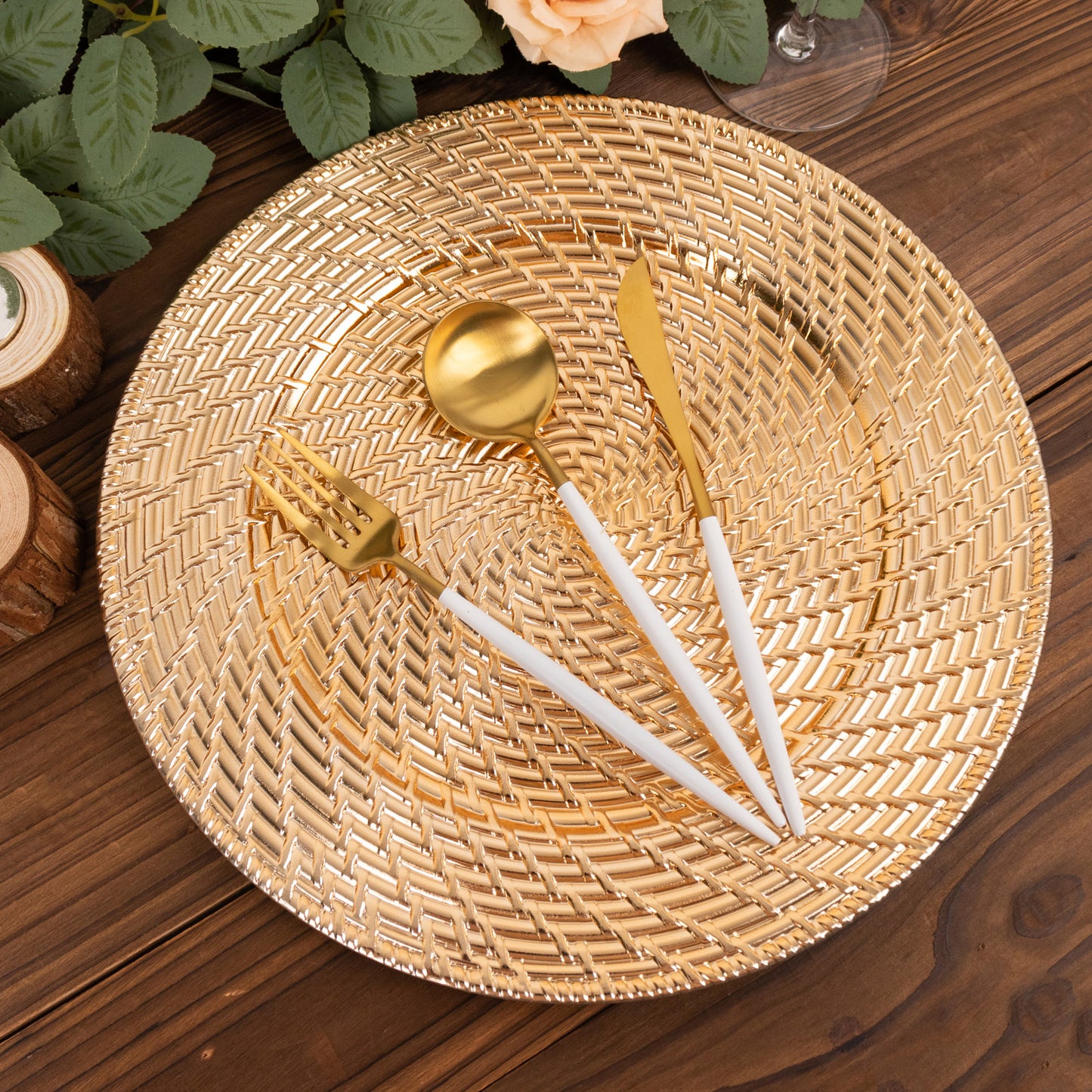 Metallic gold swirl rattan acrylic charger plate with utensils.