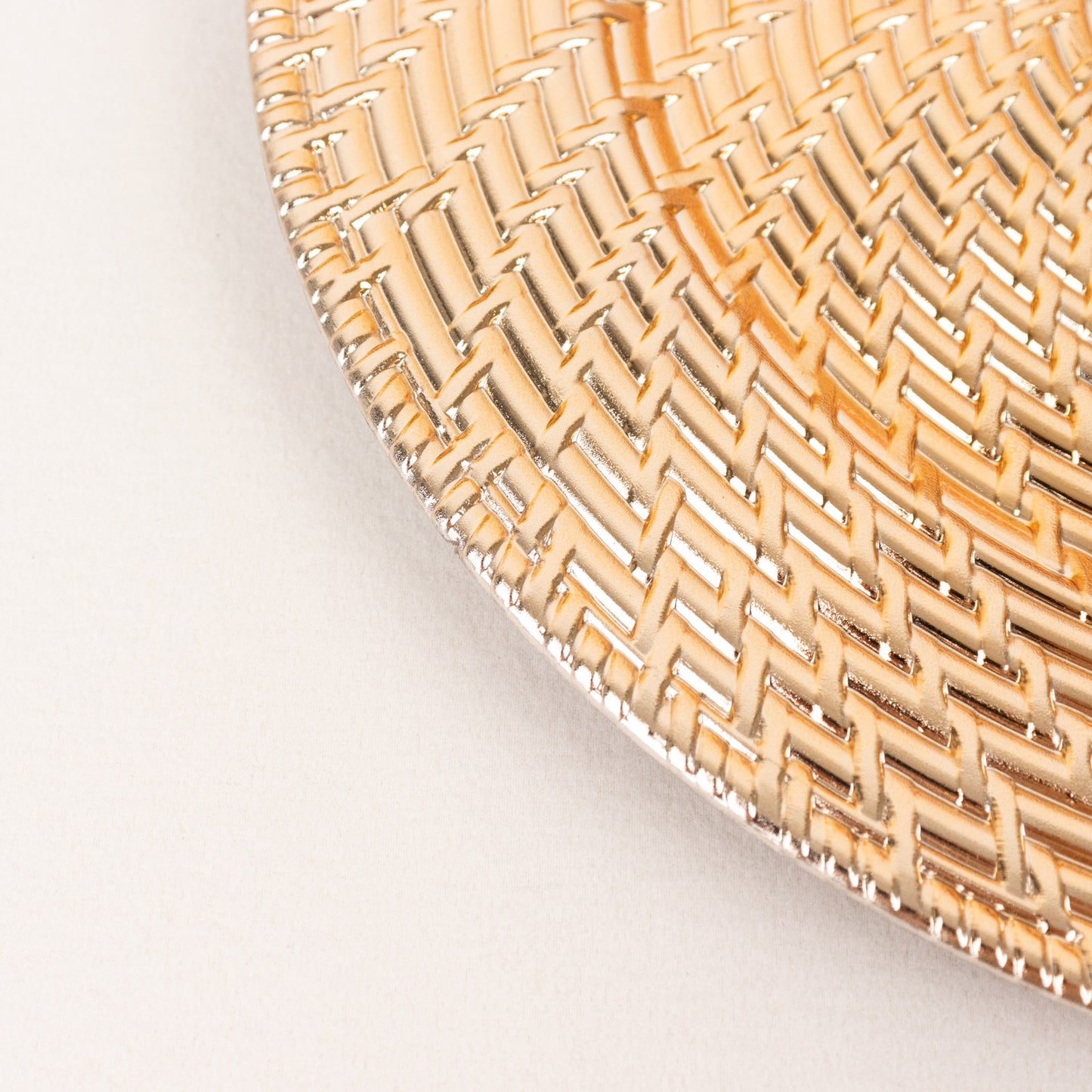 Metallic gold swirl rattan acrylic charger plate, 13" round.
