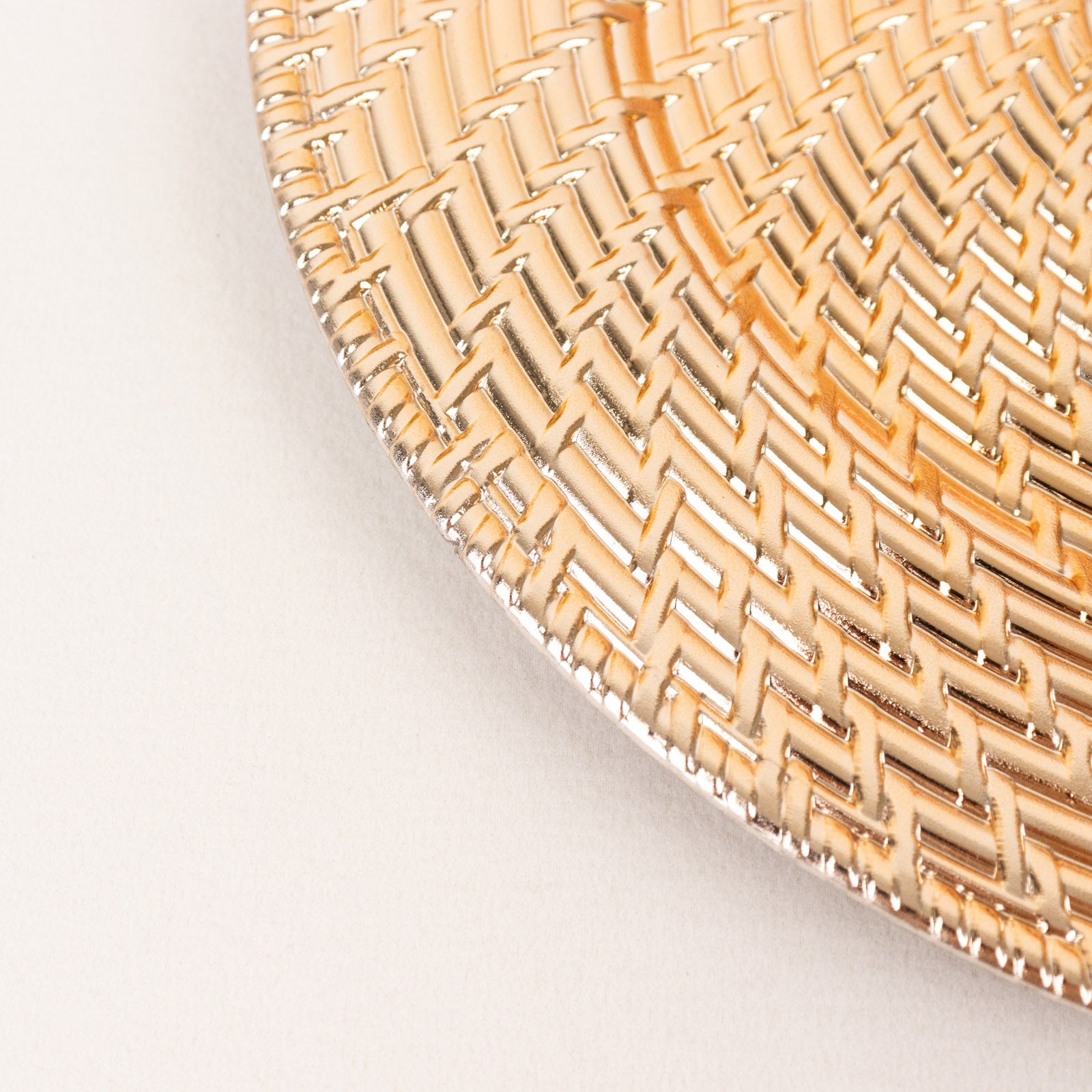 Metallic gold swirl rattan acrylic charger plate, 13" round.