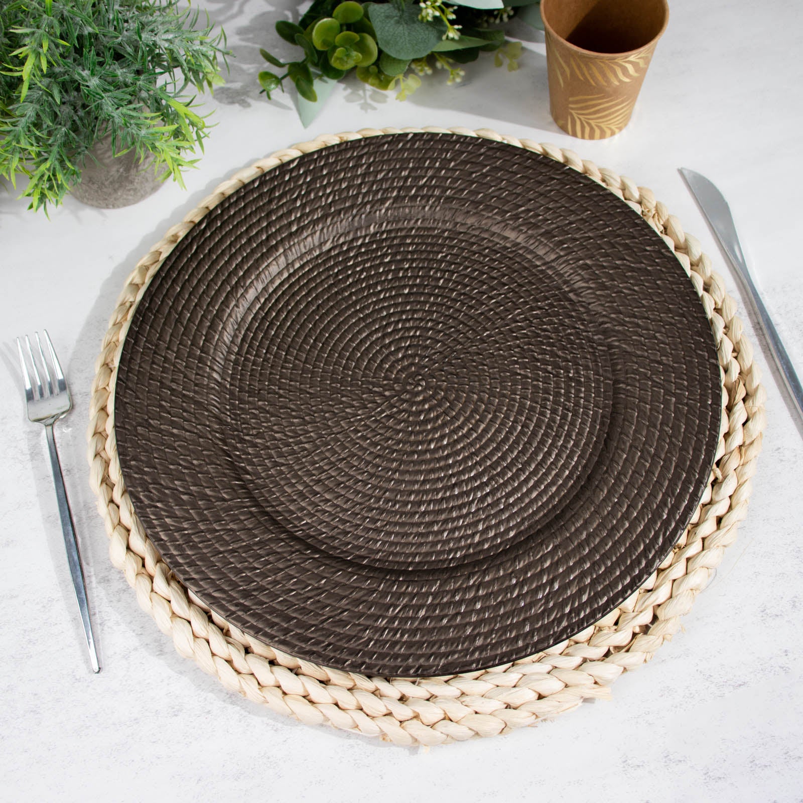 Natural brown acrylic round charger plate with rattan-like design.