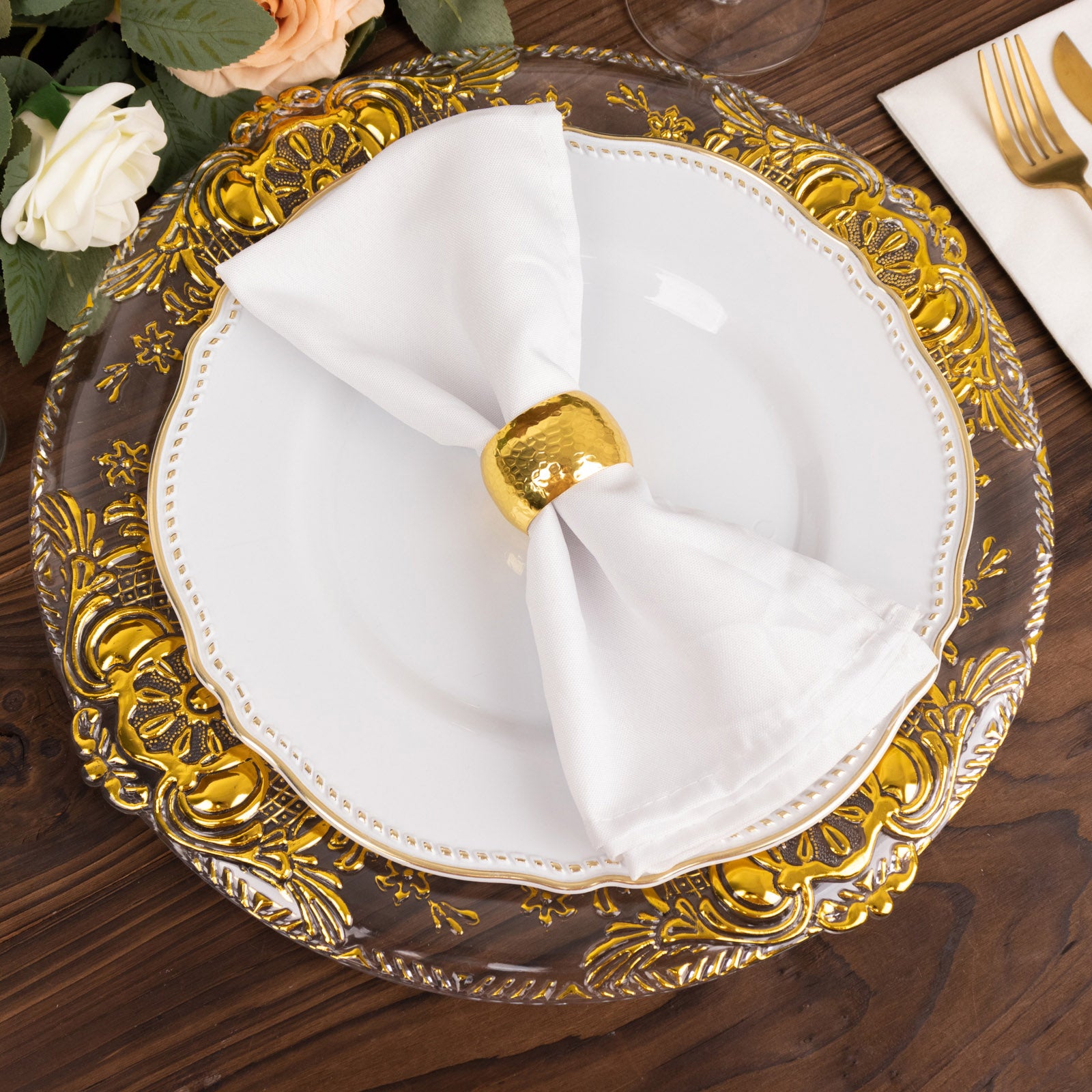 Clear decorative charger plate with gold embossed rim, 13" round.