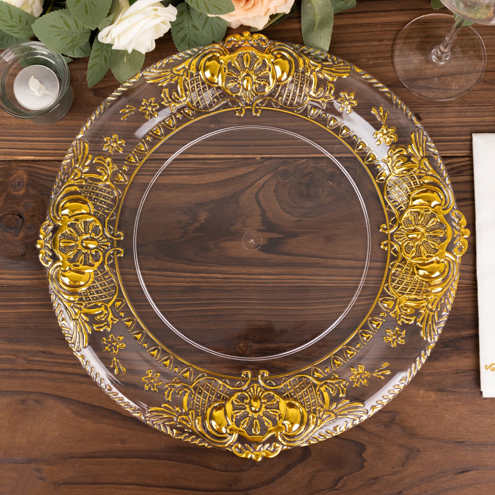 Clear decorative charger plate with gold embossed rim, 13" round.