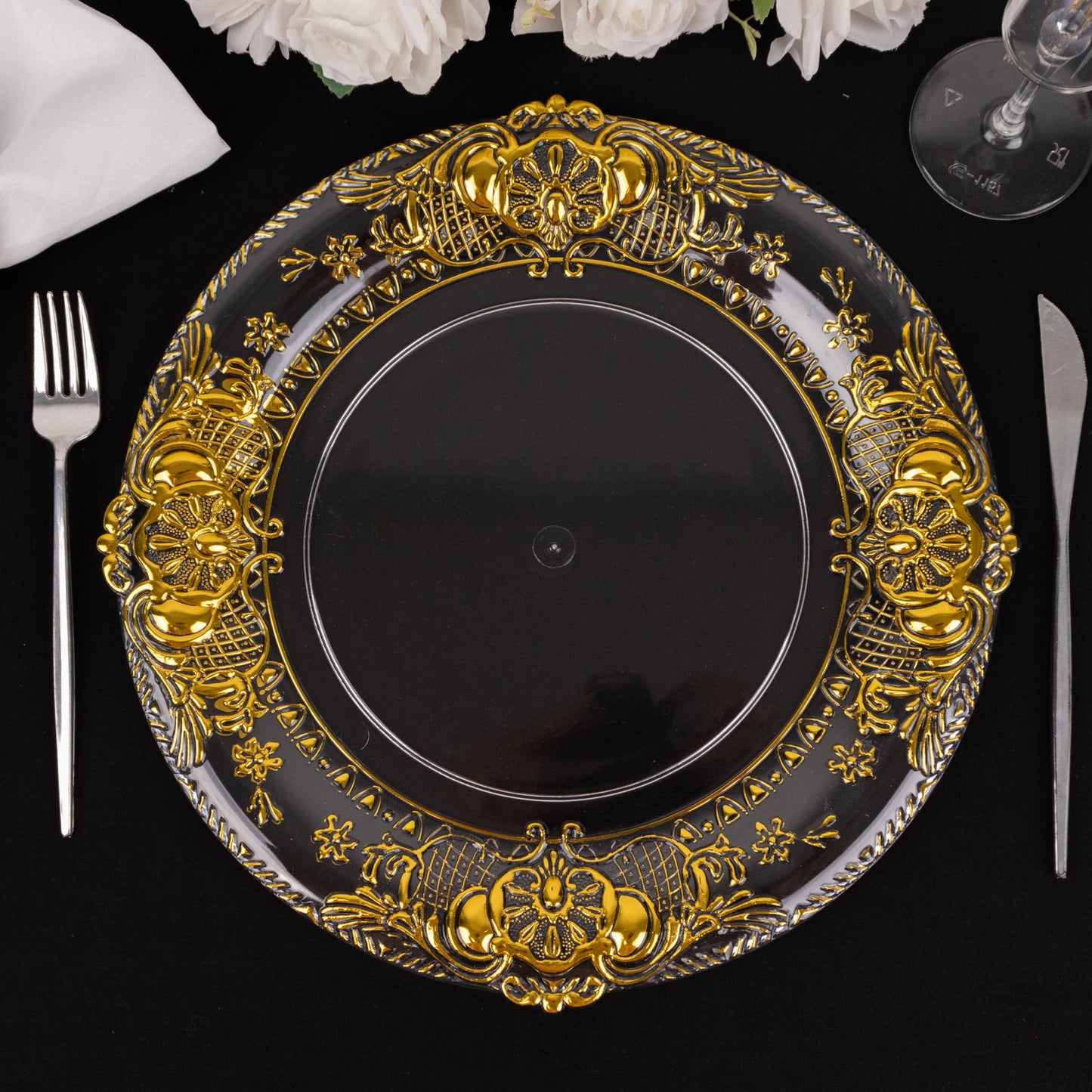 Clear decorative charger plate with gold embossed rim, 13" round.