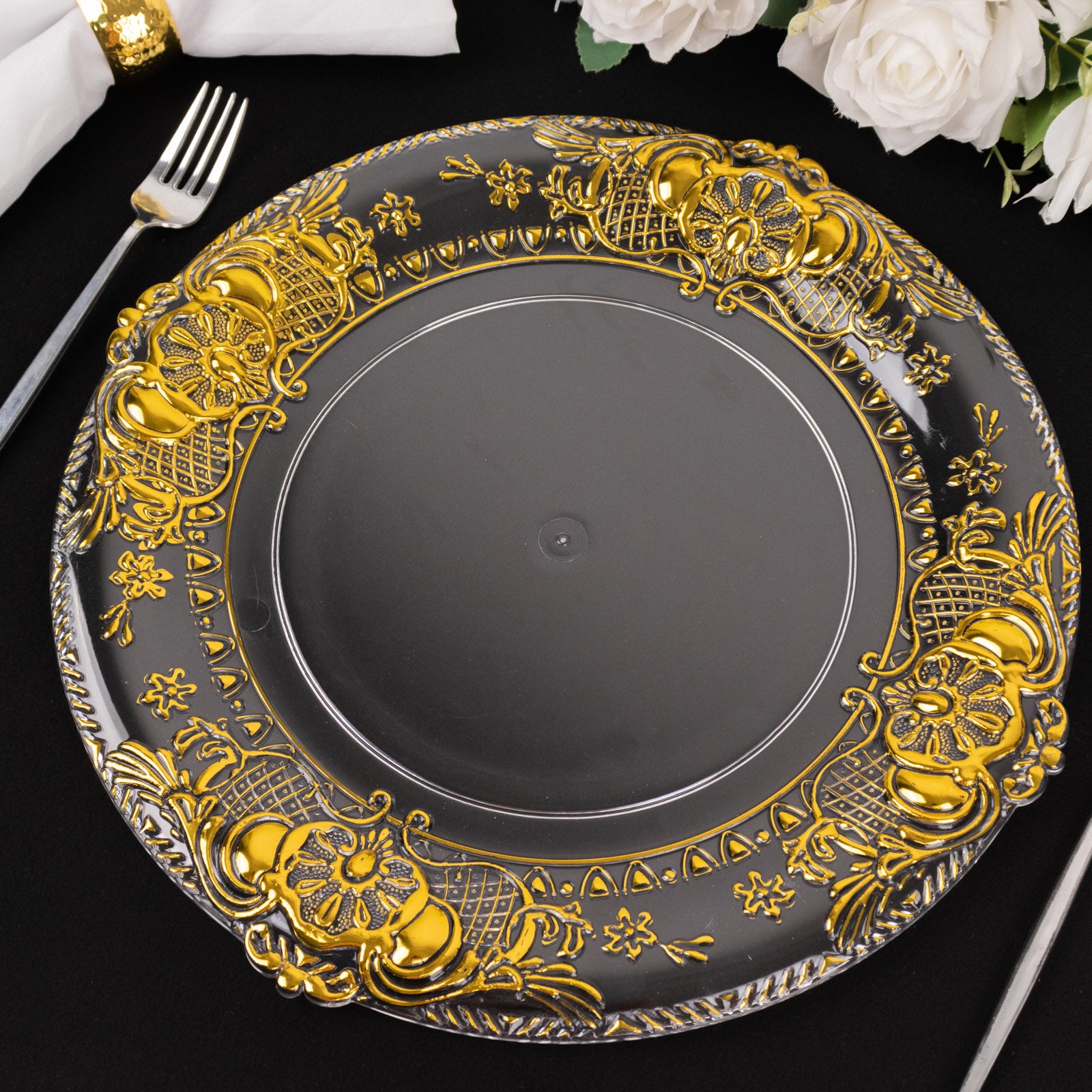 Clear decorative charger plate with gold embossed rim, 13" round.
