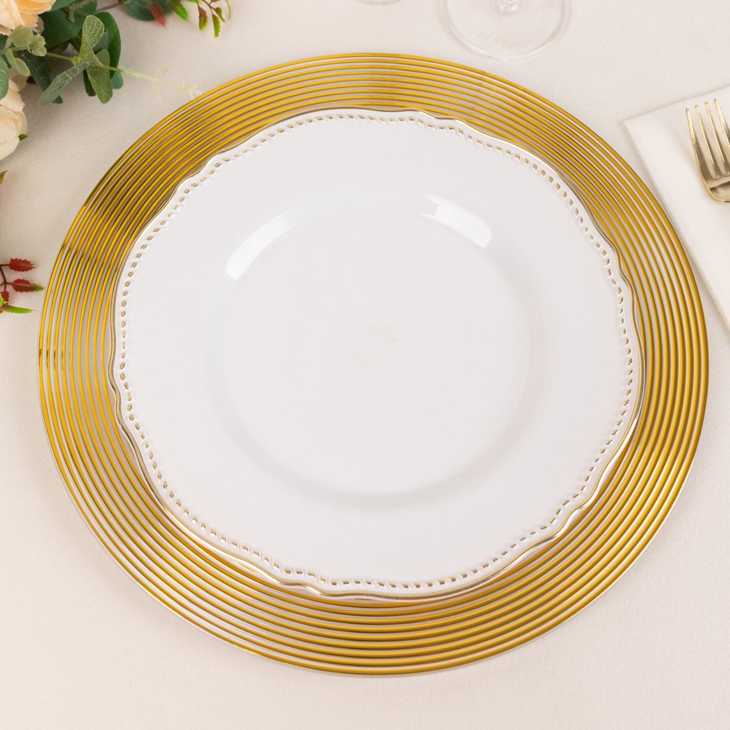 Clear and gold lined rim disposable wedding charger plate.