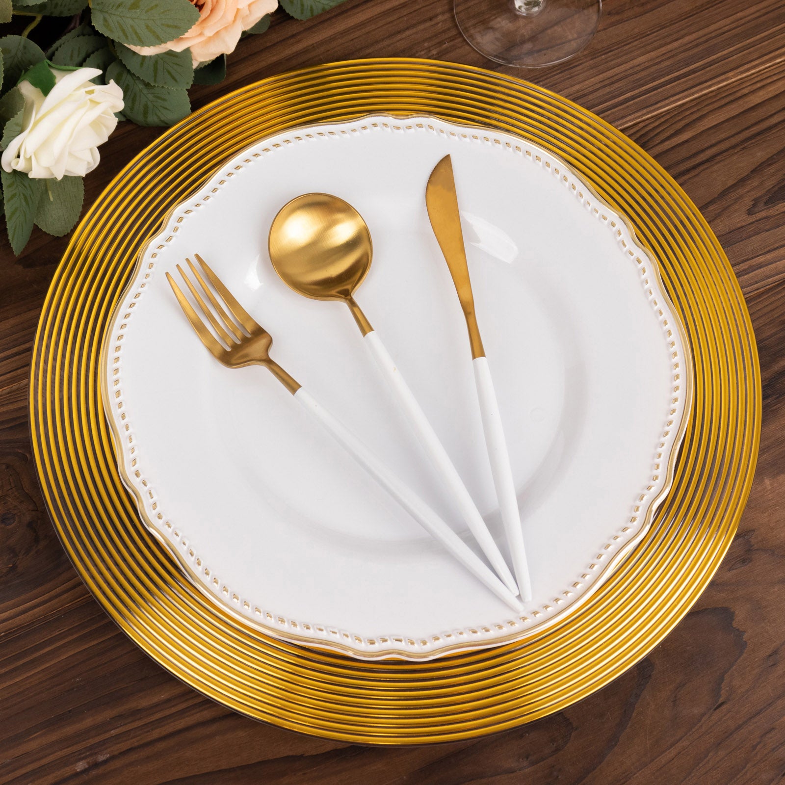 Clear and gold lined rim disposable wedding charger plate with elegant design.