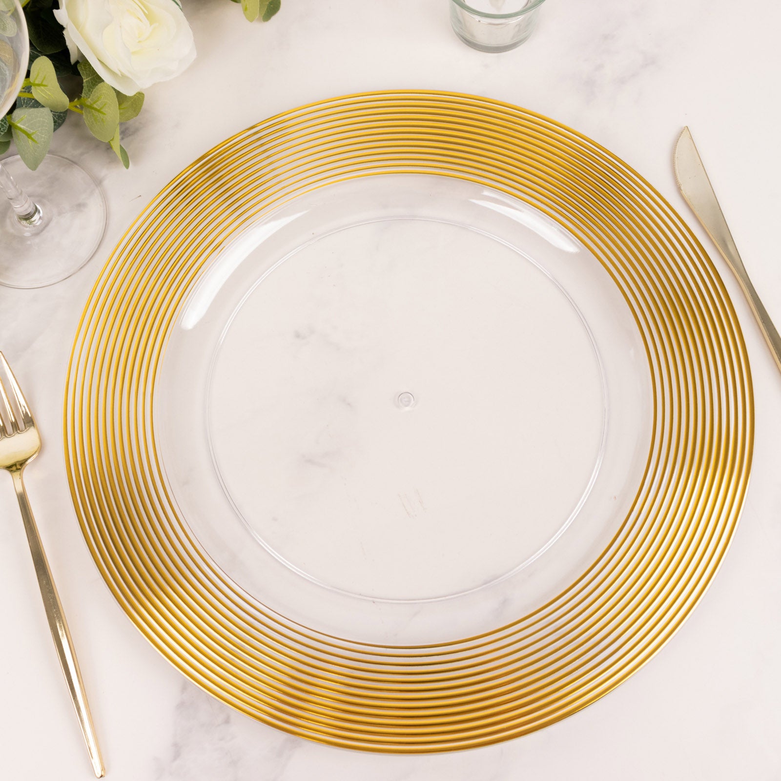 Clear and gold lined rim disposable wedding charger plate.