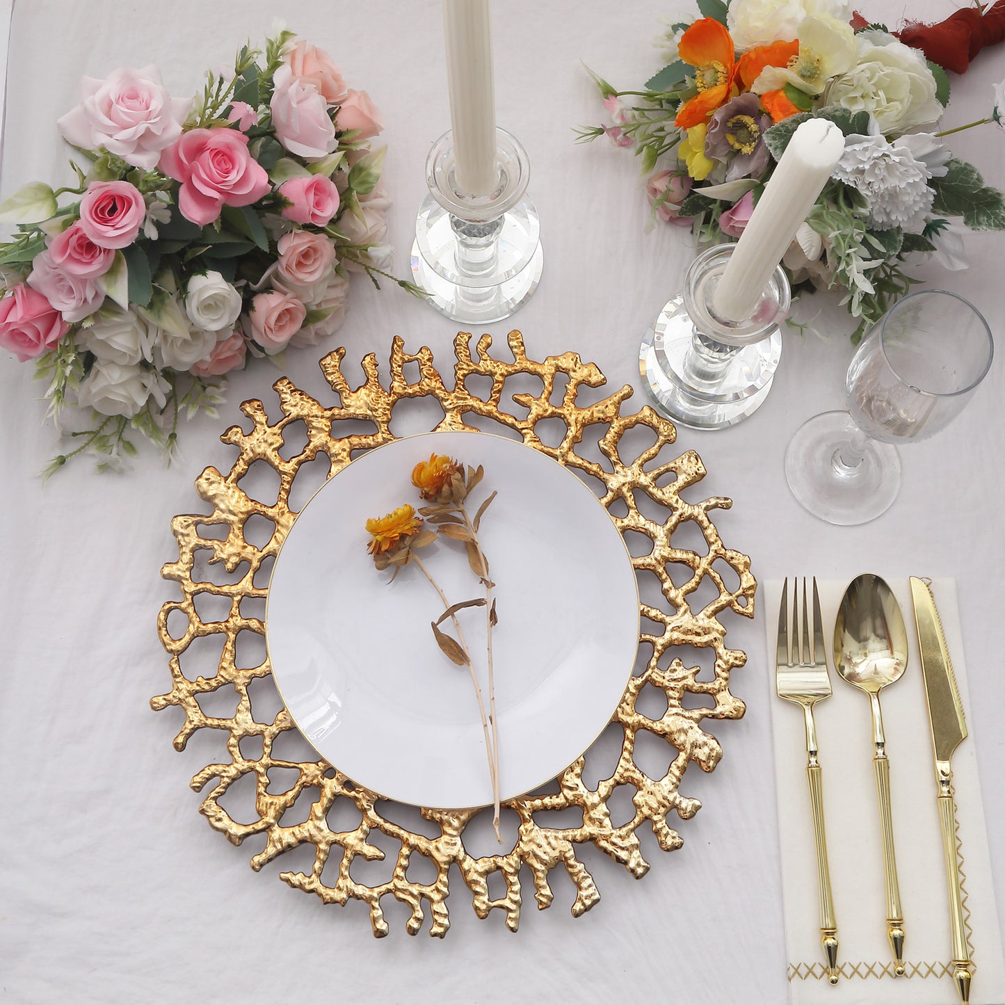 Gold acrylic charger plate with lace design, perfect for elegant table settings.