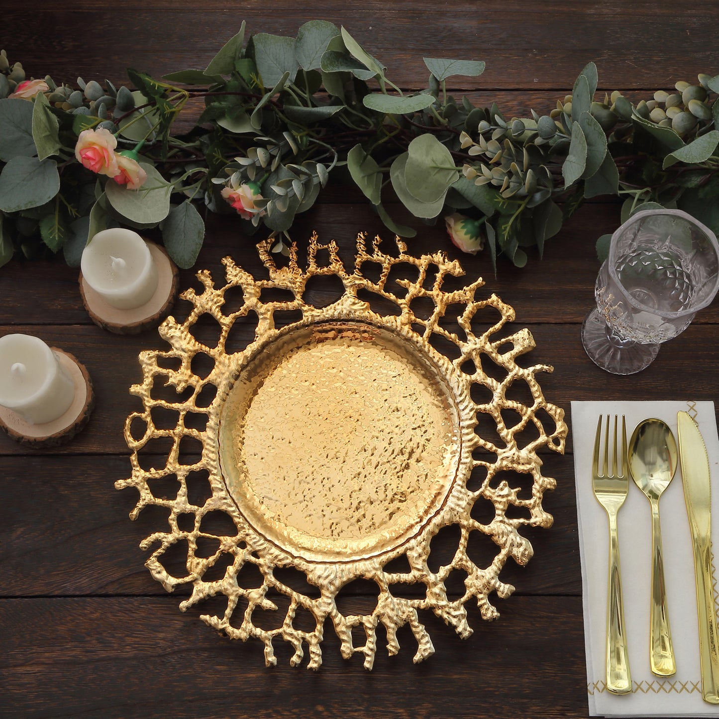 Gold molten branch acrylic charger plate on a rustic table setting.