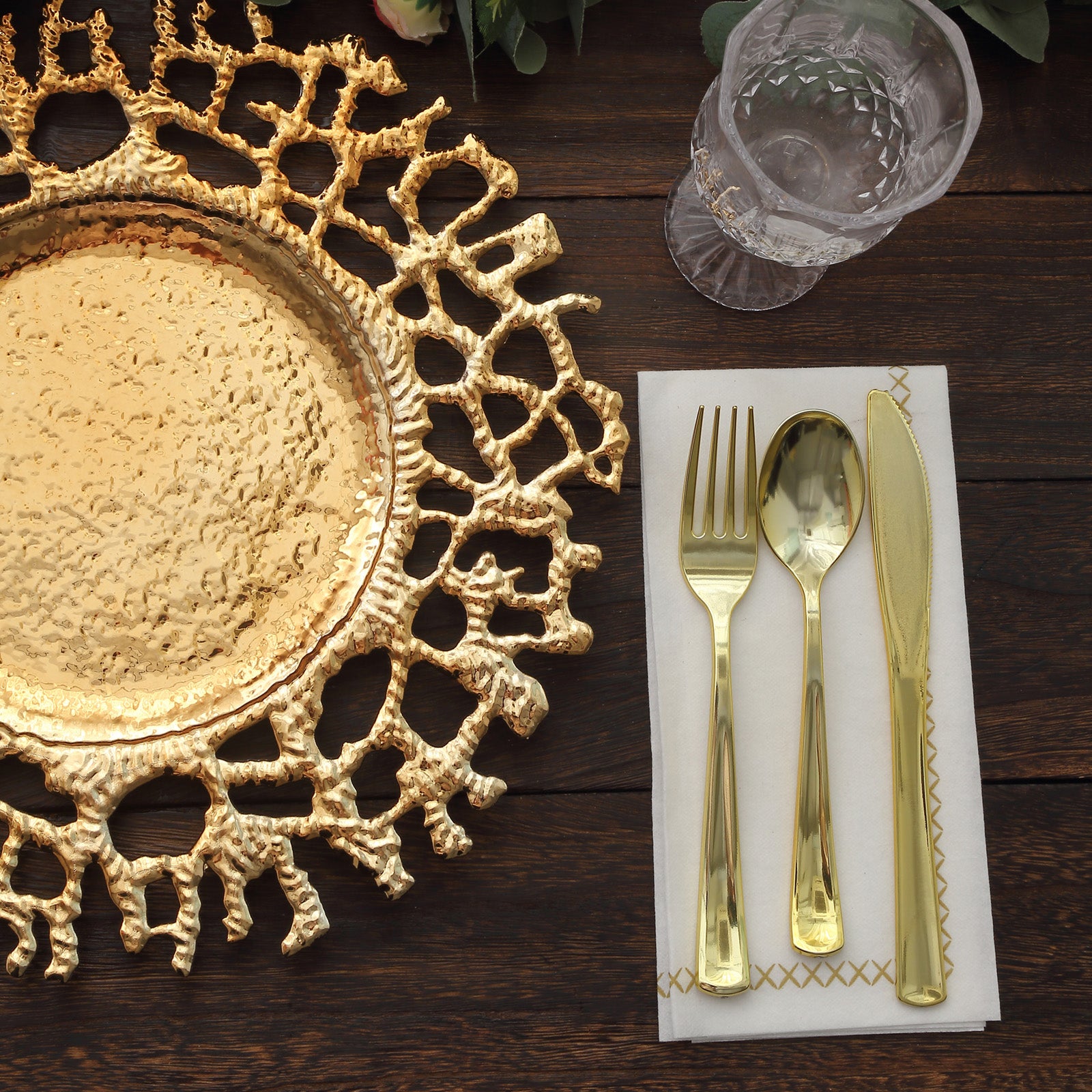 Gold acrylic charger plate with decorative lace design.