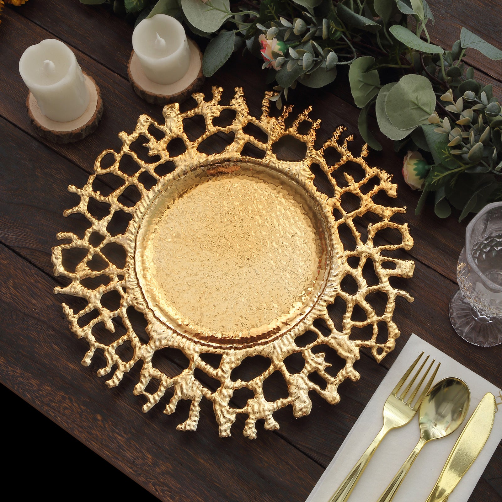 Gold molten branch acrylic charger plate on a rustic table setting.