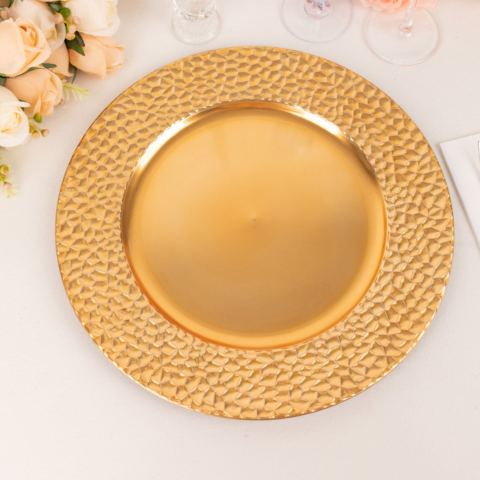 Metallic gold acrylic dinner serving plate with hammered rim.