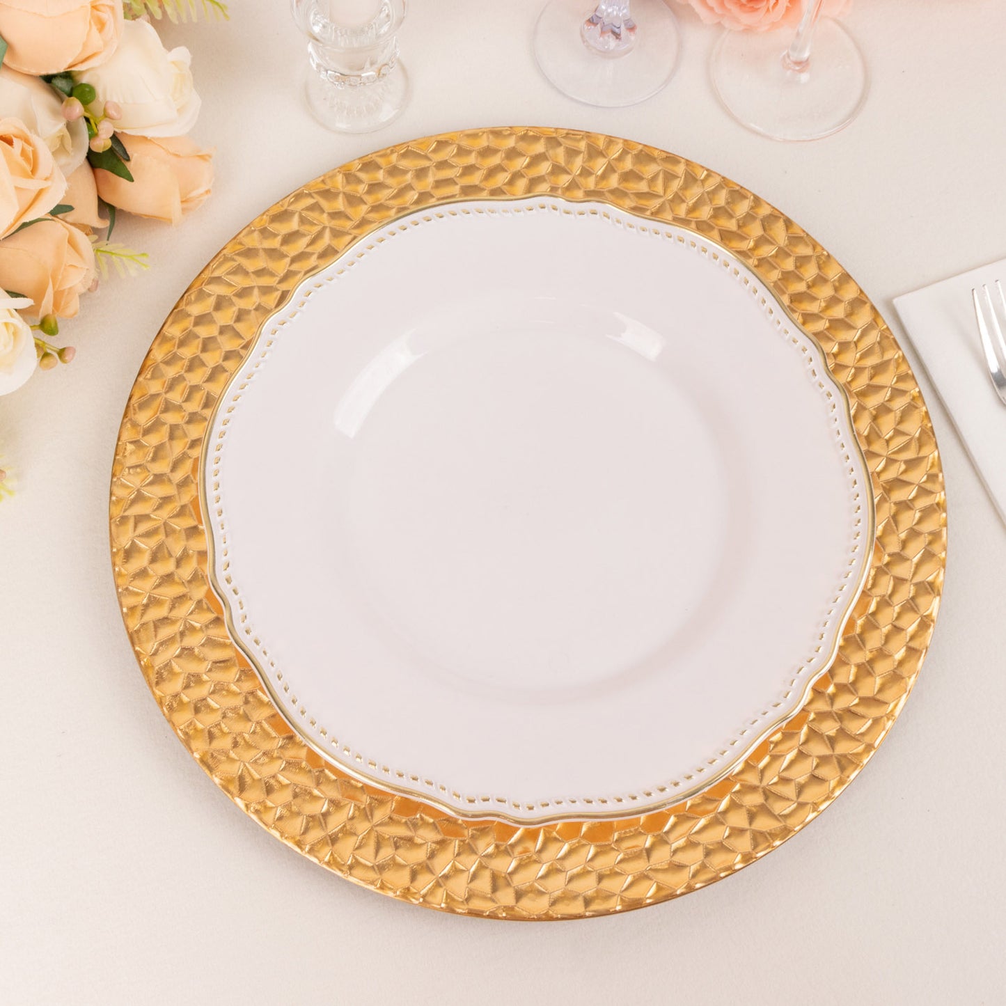 Metallic gold acrylic dinner serving plates with hammered rim.