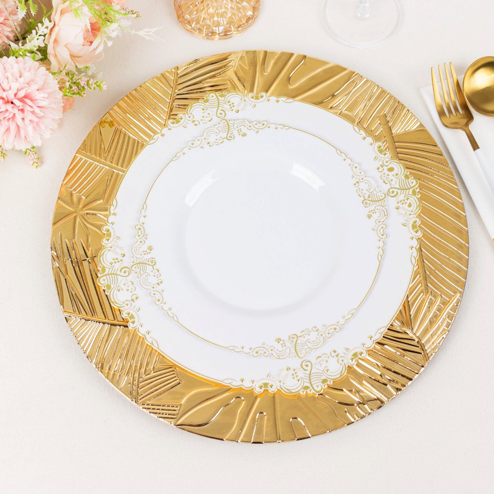 Metallic gold charger plates with embossed tropical leaves, 13" round.