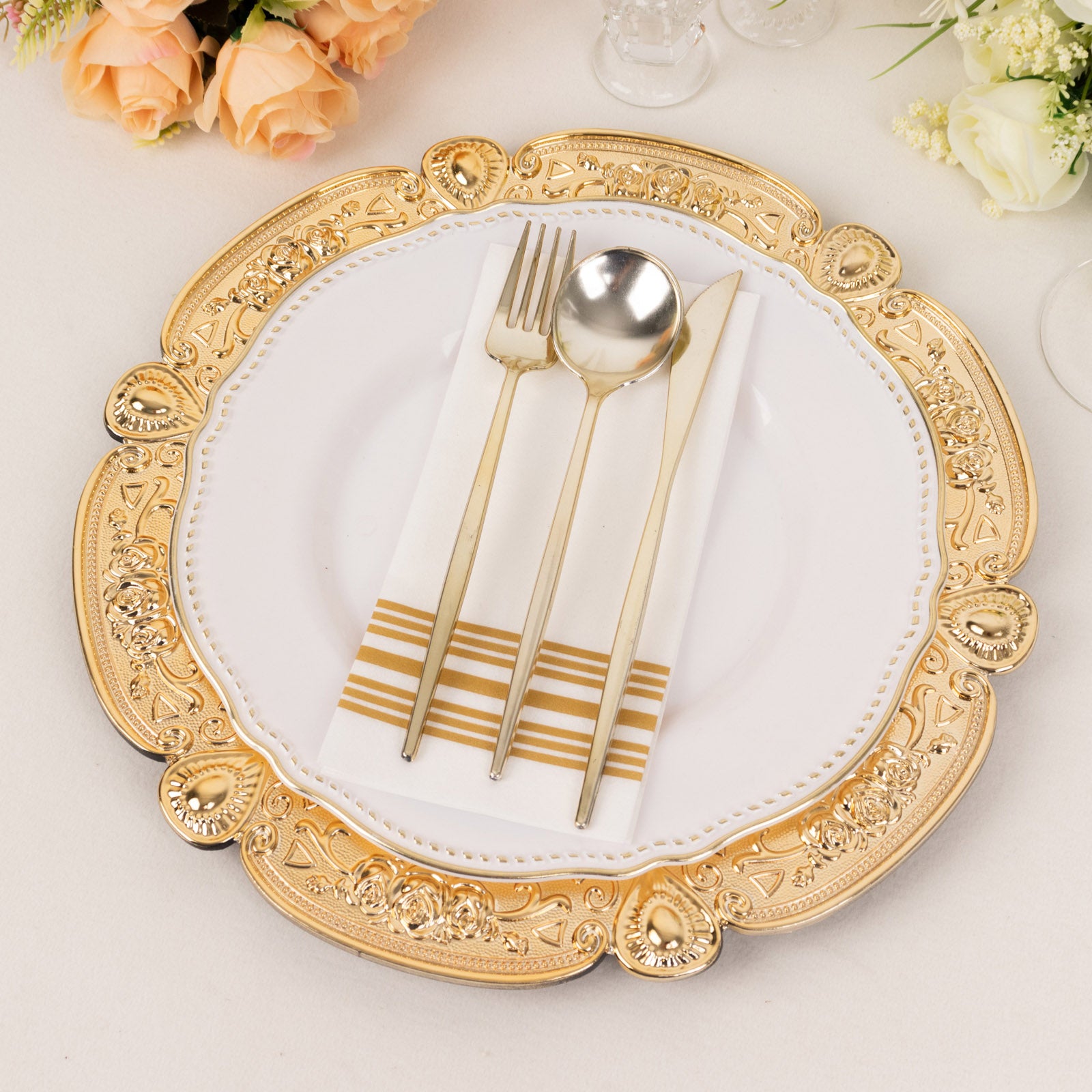 Gold round acrylic charger plate with floral embossed scalloped rim.