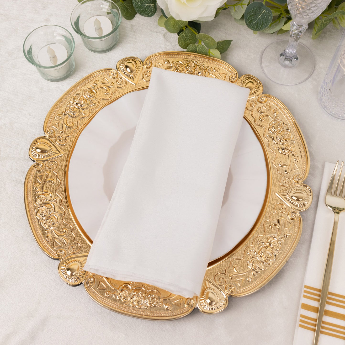 Gold round acrylic charger plate with floral embossed scalloped rim.