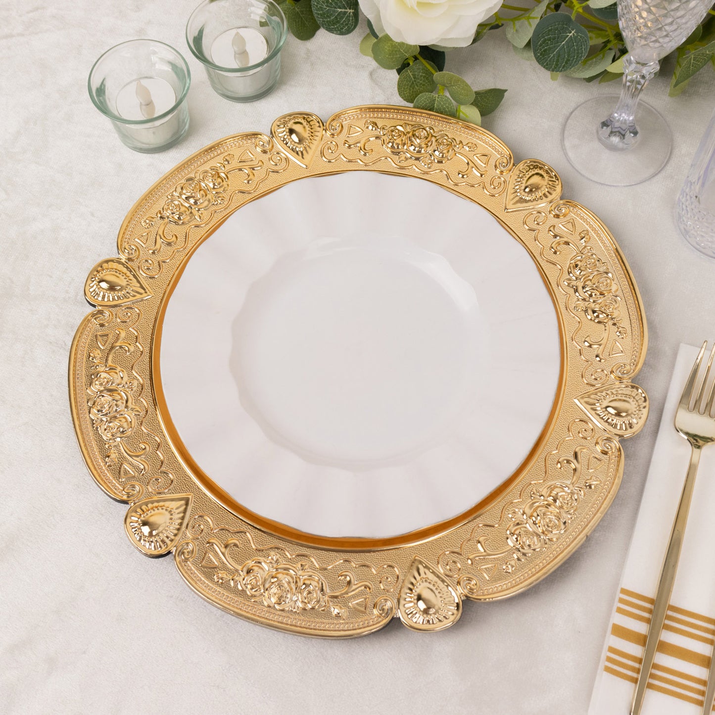 Gold round acrylic charger plate with floral embossed scalloped rim.