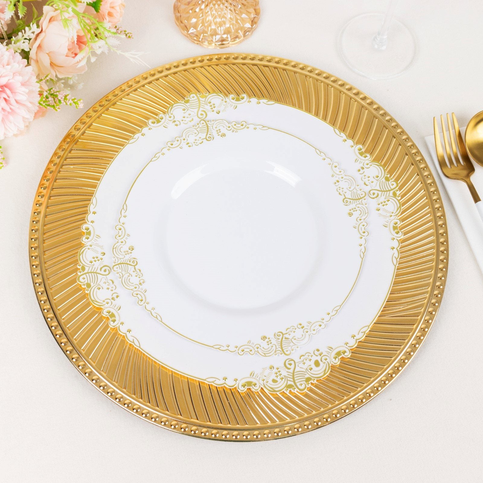 Metallic gold swirl pattern round acrylic charger plate with beaded rim.