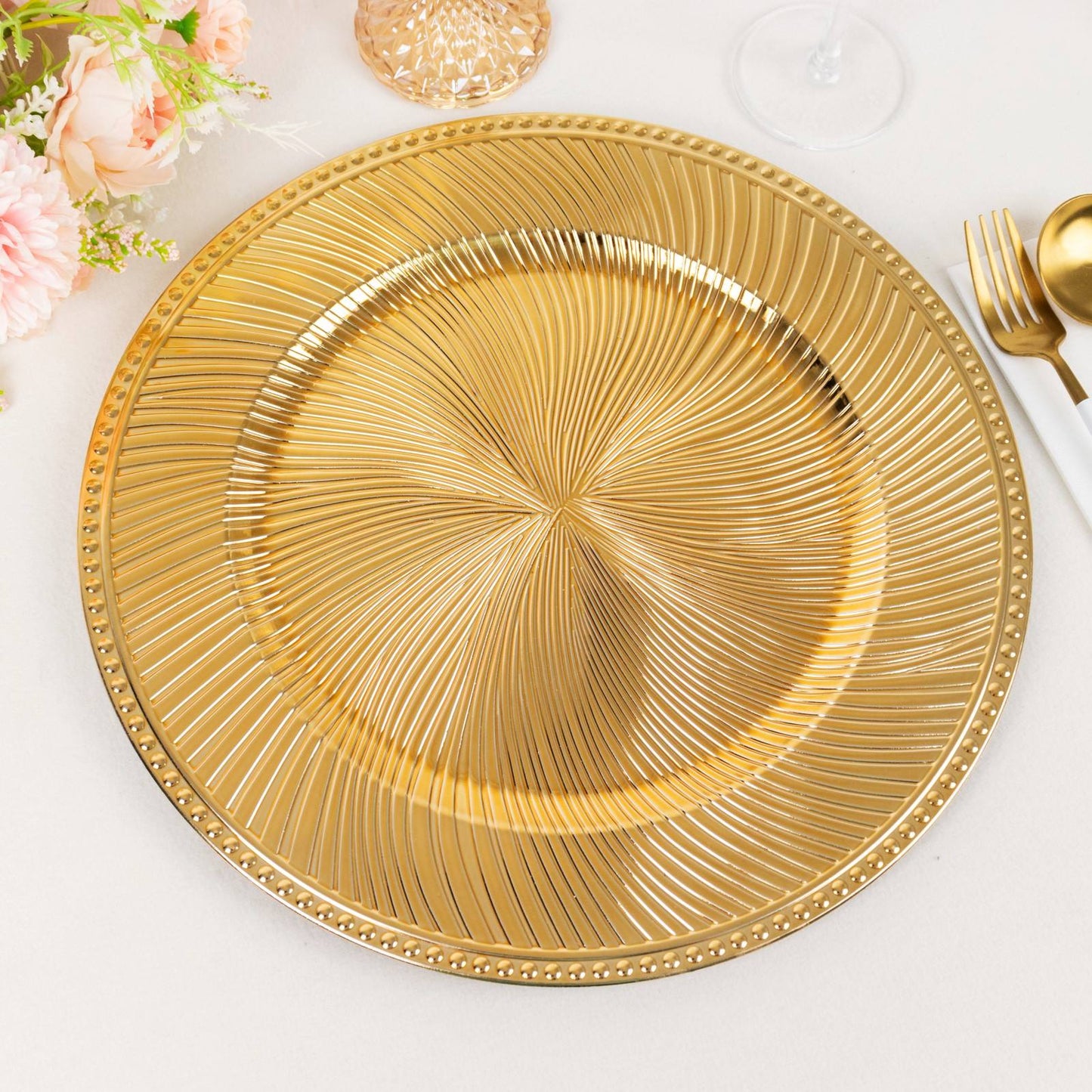 Metallic gold swirl pattern round acrylic charger plate with beaded rim.