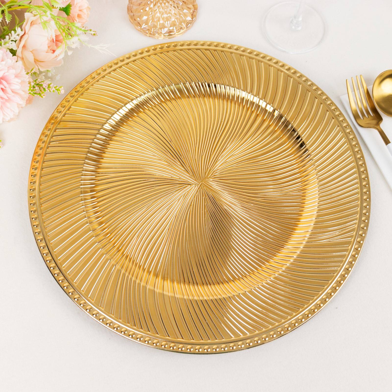 Metallic gold swirl pattern round acrylic charger plate with beaded rim.