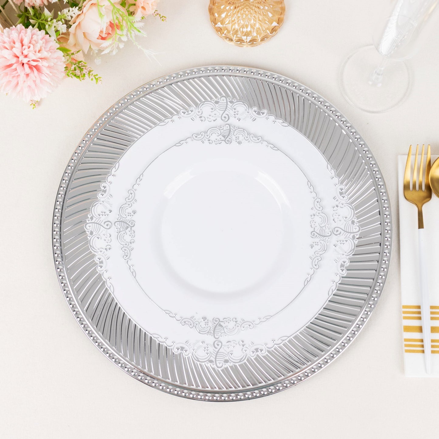 Metallic silver swirl pattern acrylic charger plate with beaded rim.