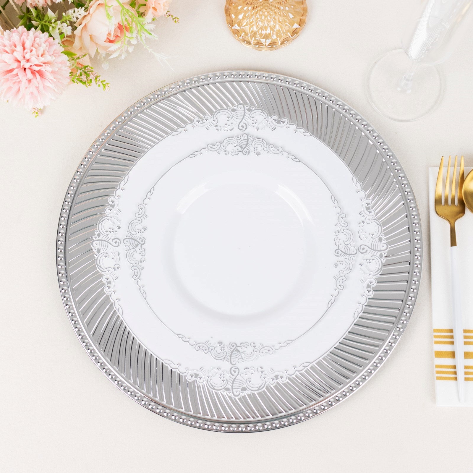 Metallic silver swirl pattern acrylic charger plate with beaded rim.