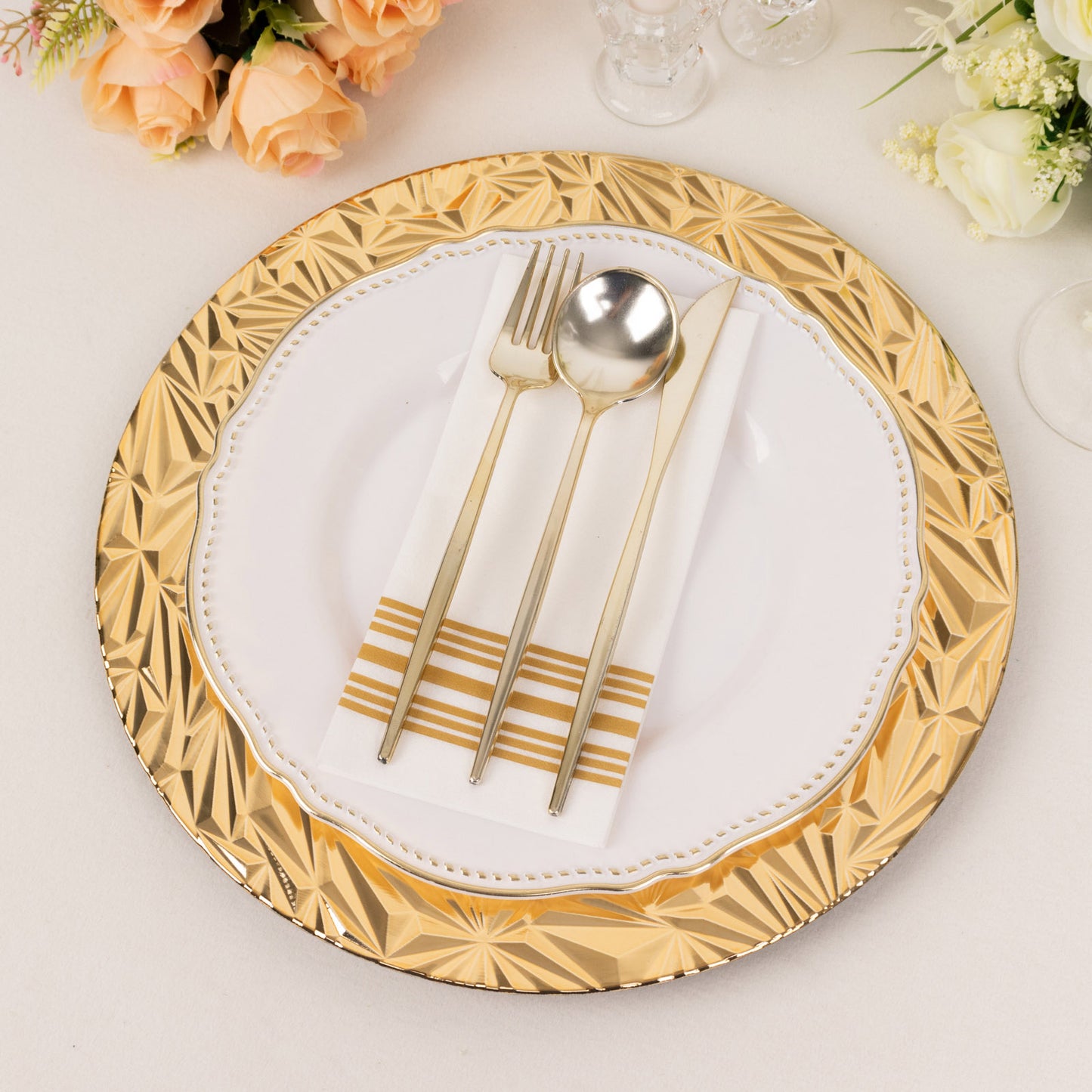 Metallic gold rock cut acrylic charger plate with elegant table setting.