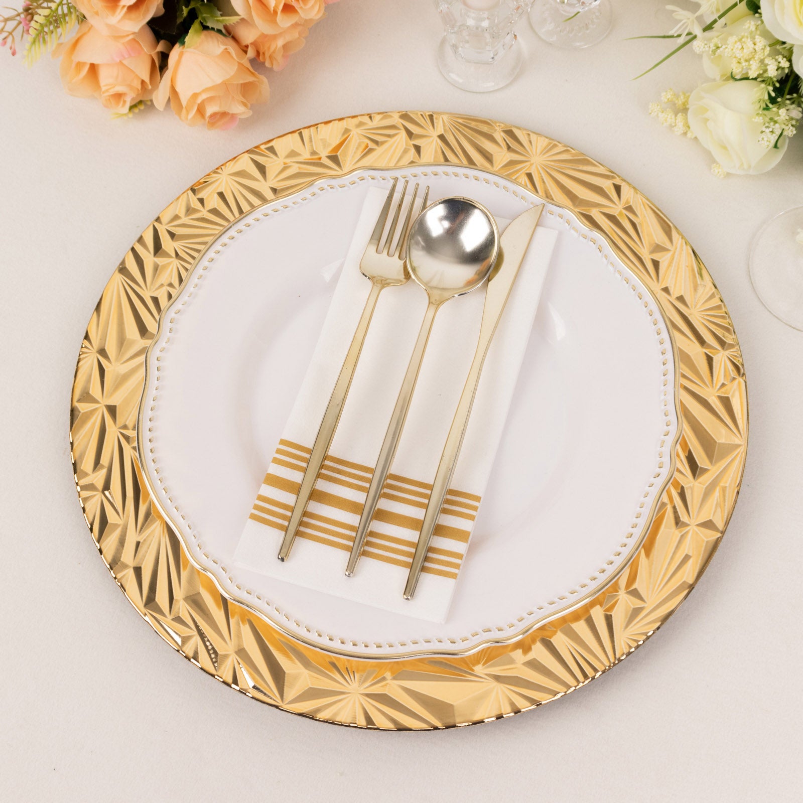 Metallic gold rock cut acrylic charger plate with elegant table setting.