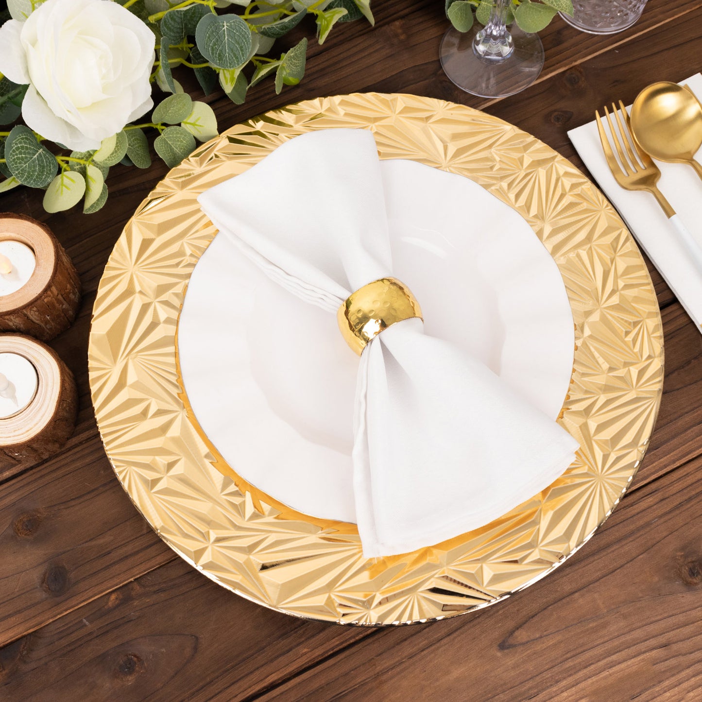 Metallic gold rock cut acrylic charger plate with white napkin and decorative setting.