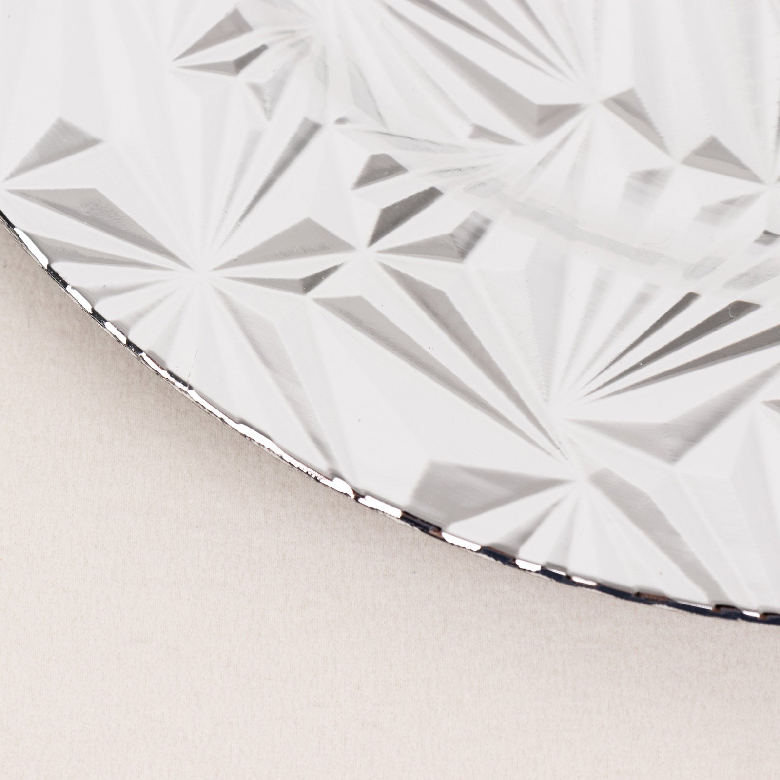 Metallic silver rock cut acrylic charger plate, decorative serving dish.