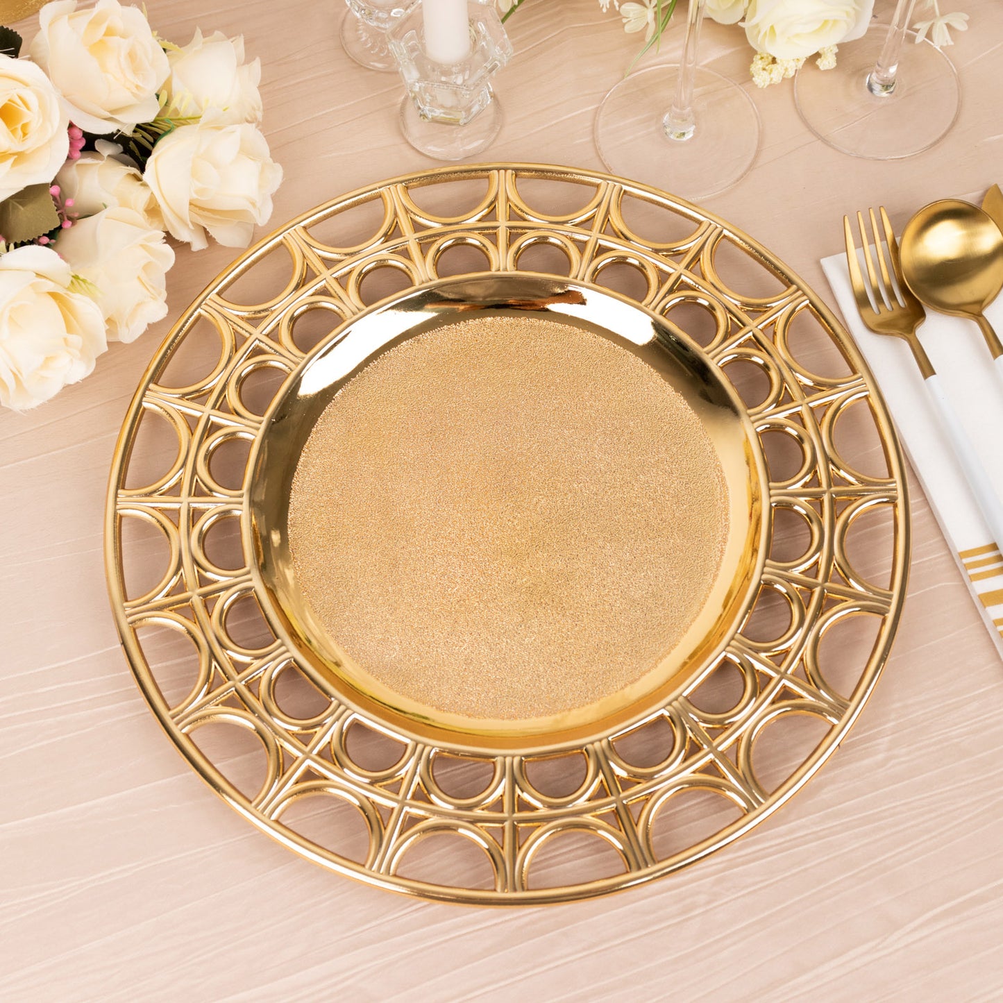 Metallic gold decorative charger plate with semi-circle hollow out rim.
