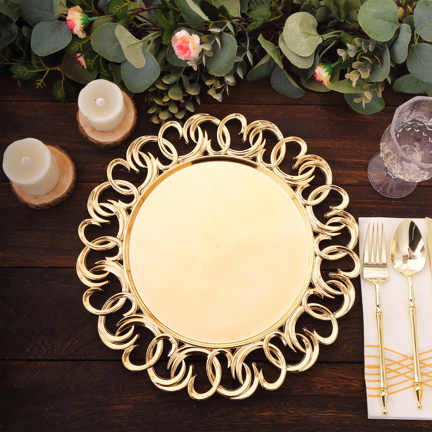 Gold disposable charger plate with entwined swirl rim on a rustic wooden table.
