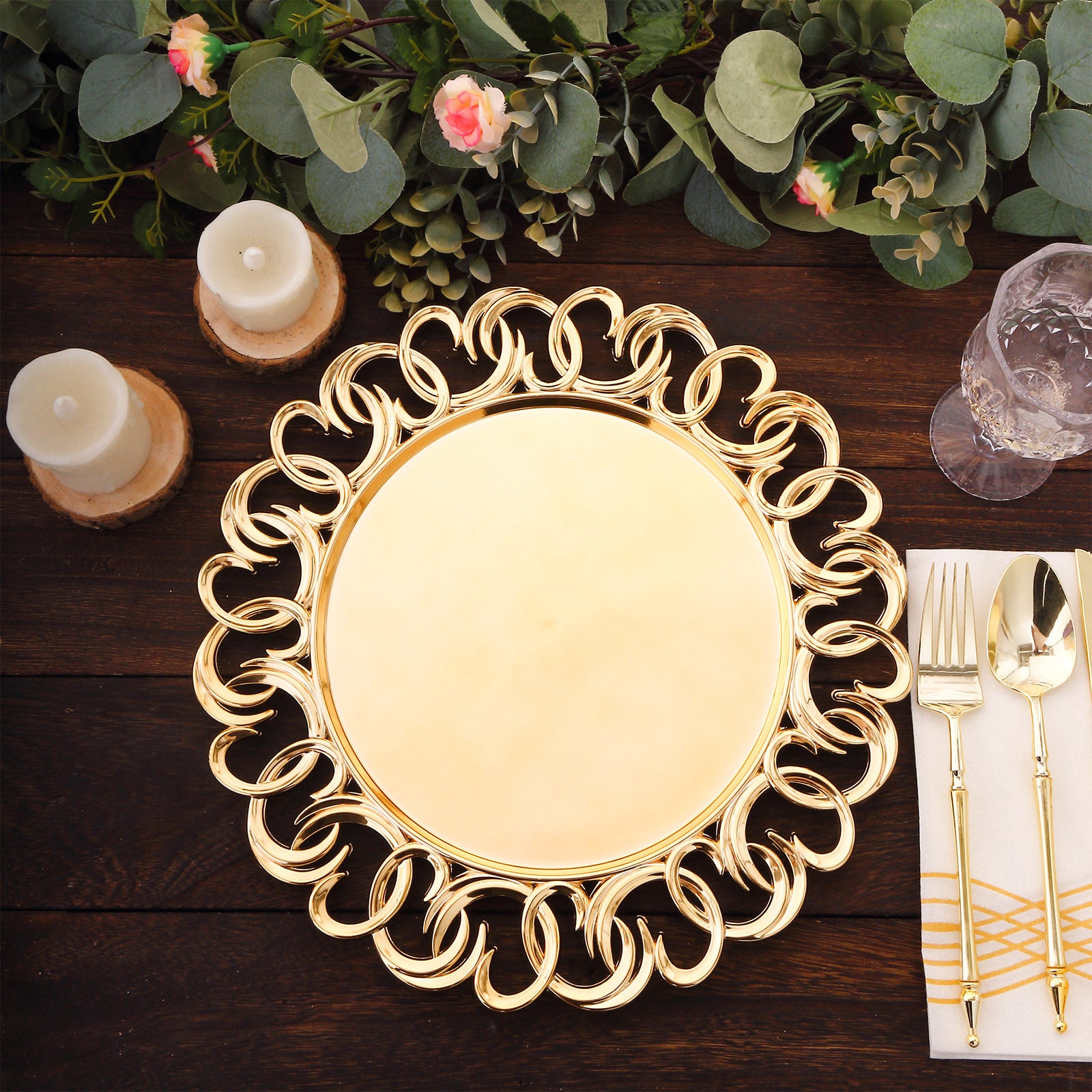 Gold disposable charger plate with entwined swirl rim on a rustic wooden table.