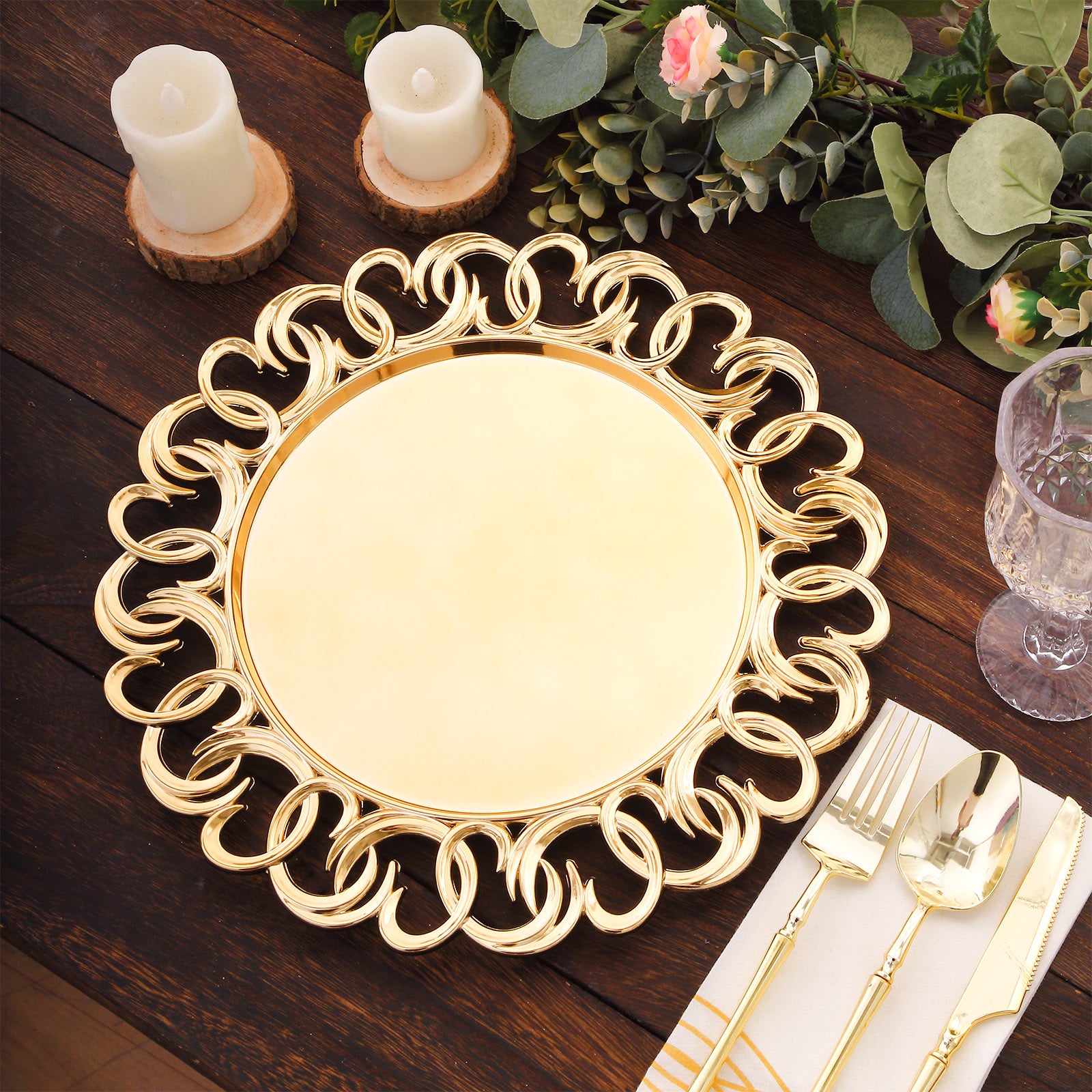 Gold disposable charger plate with entwined swirl rim on a wooden table setting.