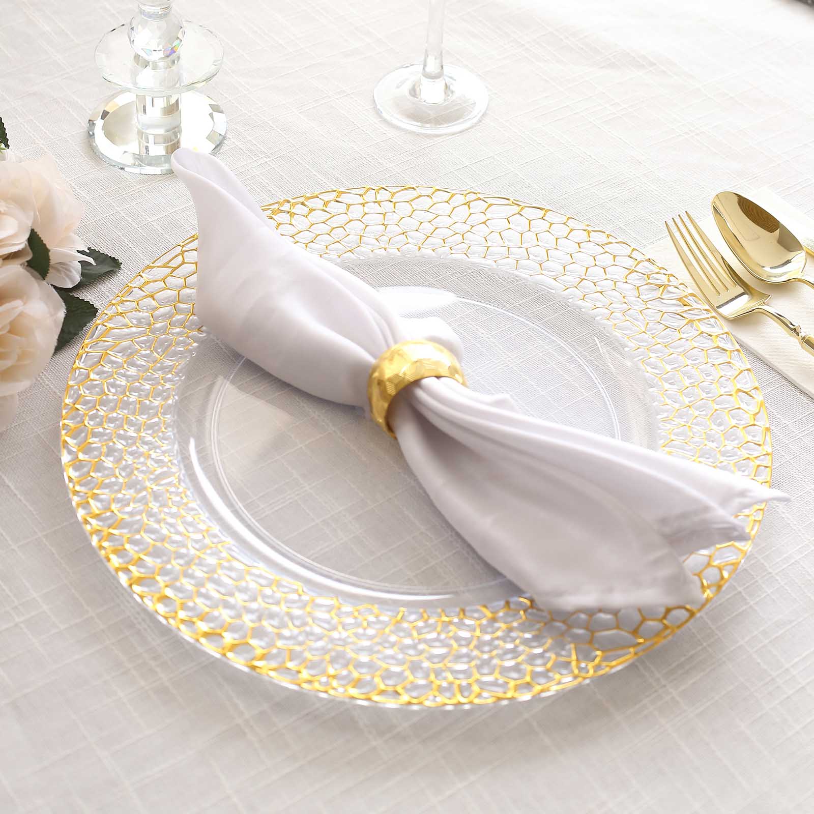 Clear acrylic charger plate with gold hammered rim, elegant table setting.