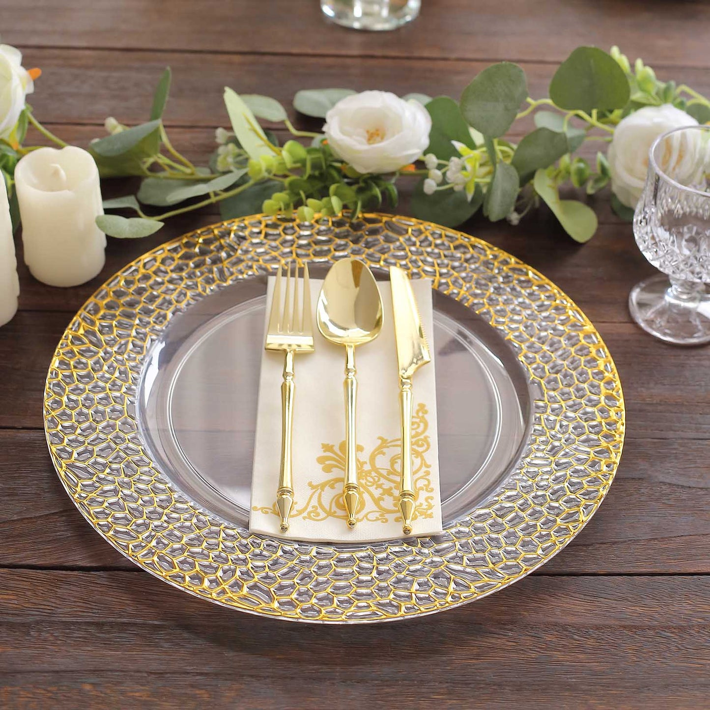 Clear acrylic round charger plates with gold hammered rim.