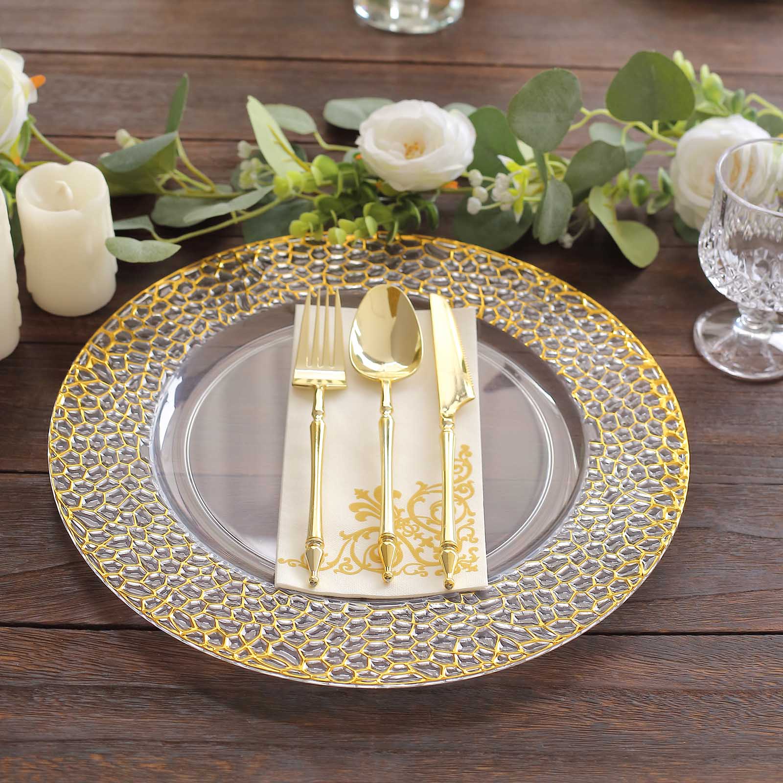 Clear acrylic round charger plates with gold hammered rim.