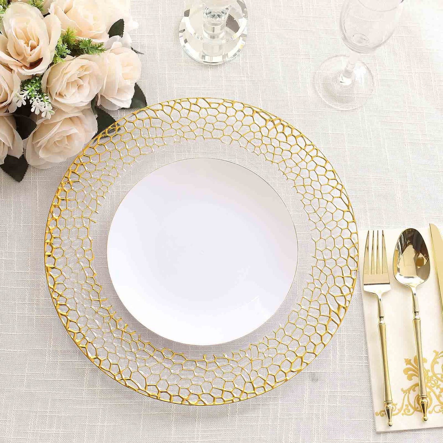 Clear acrylic charger plate with gold hammered rim, decorative serving dish, elegant design.
