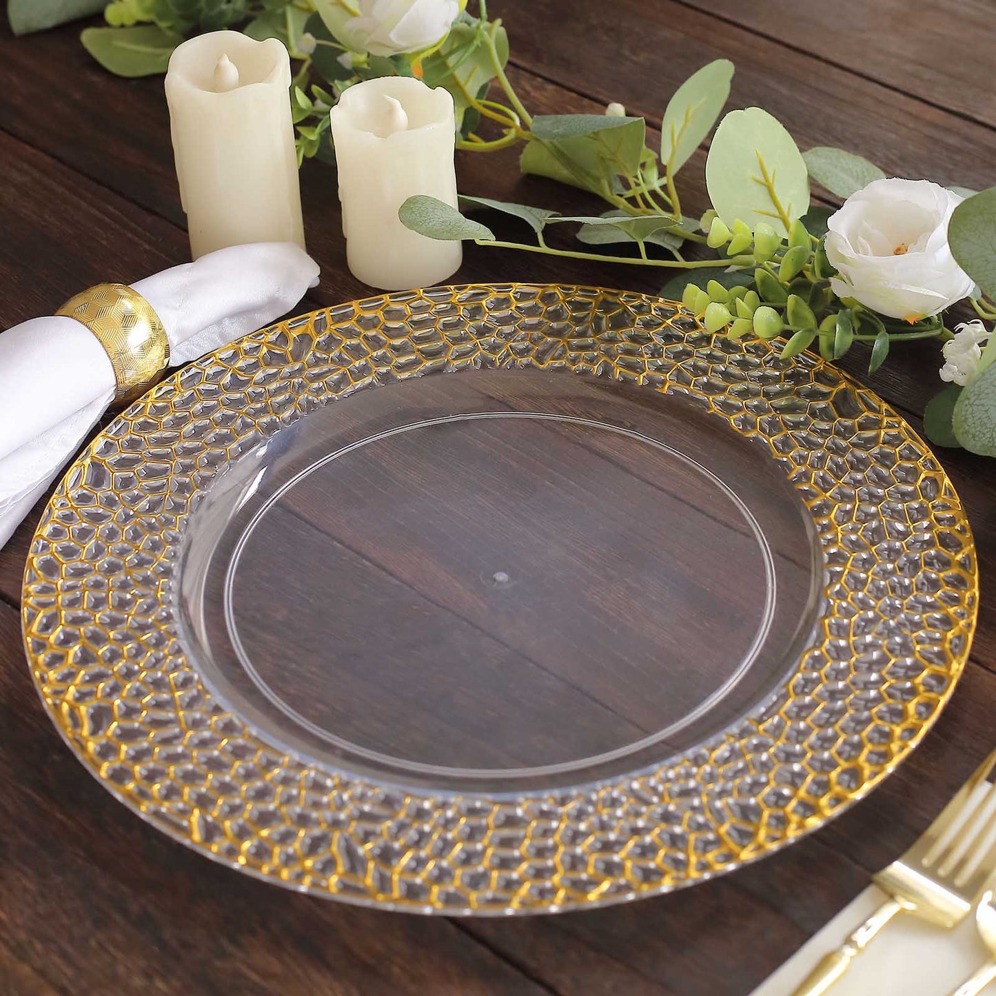 Clear acrylic charger plate with gold hammered rim, 13 inches in diameter.