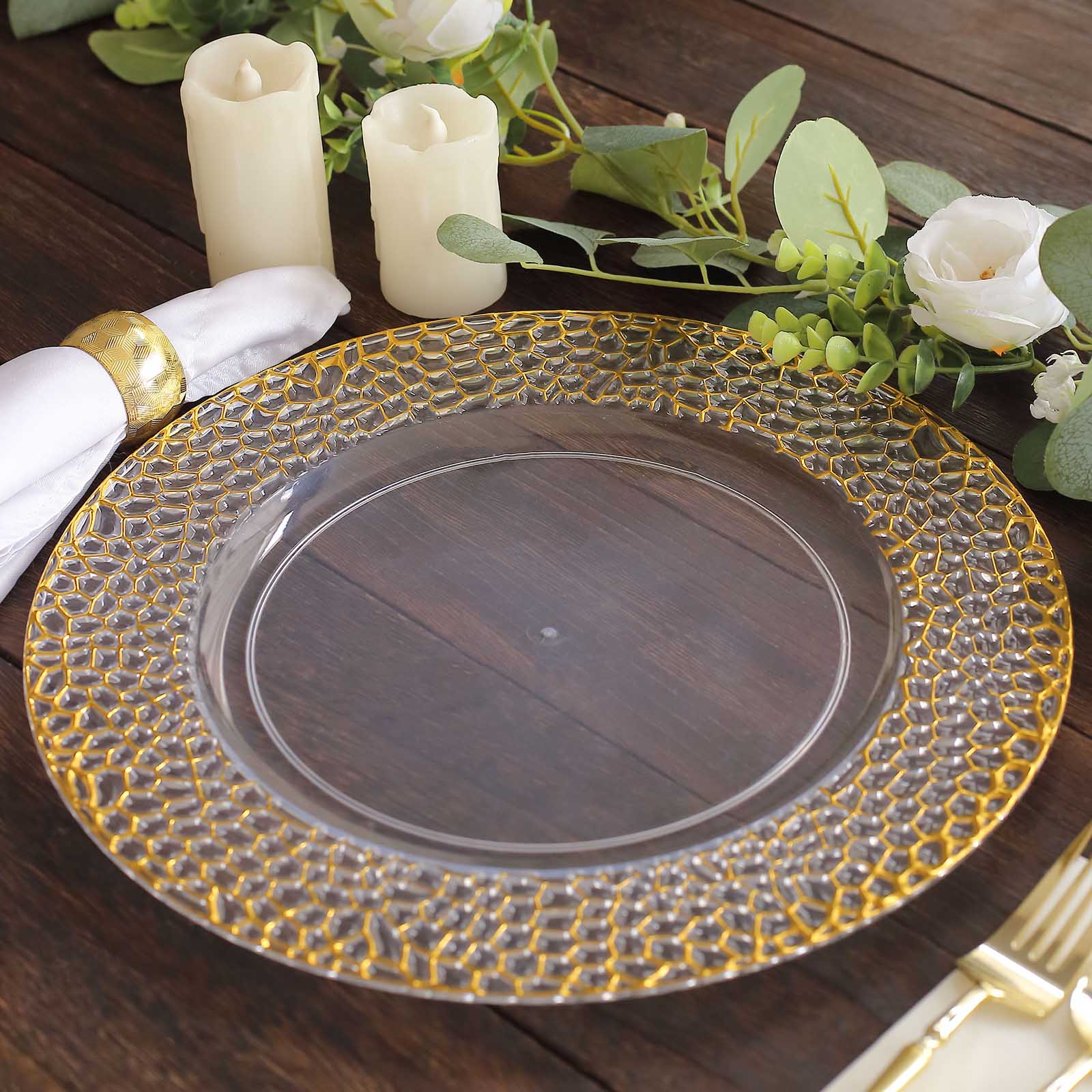 Clear acrylic charger plate with gold hammered rim, 13 inches in diameter.
