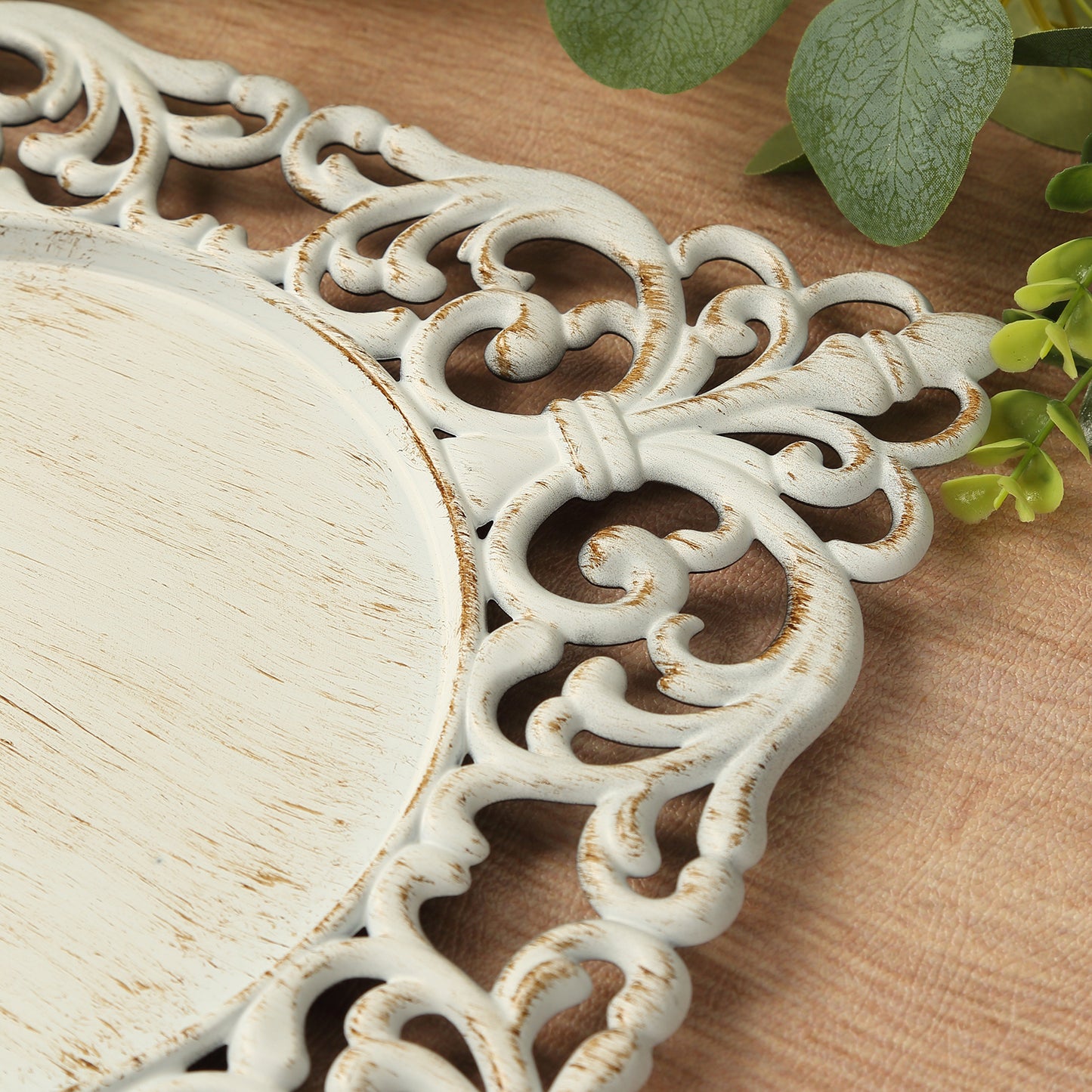 Antique white square acrylic charger plate with hollow lace border.