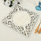 Antique white square acrylic charger plate with lace border.