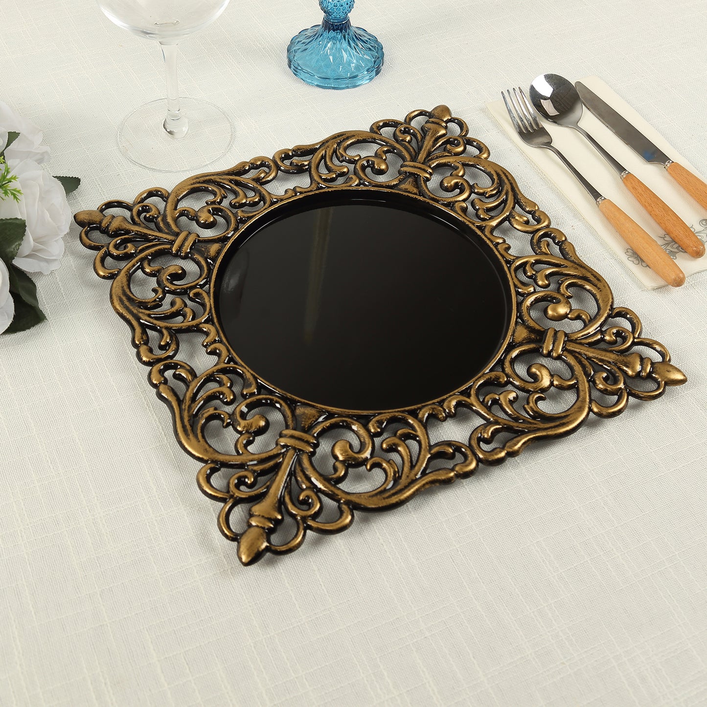 Black square acrylic charger plate with antique gold lace border.