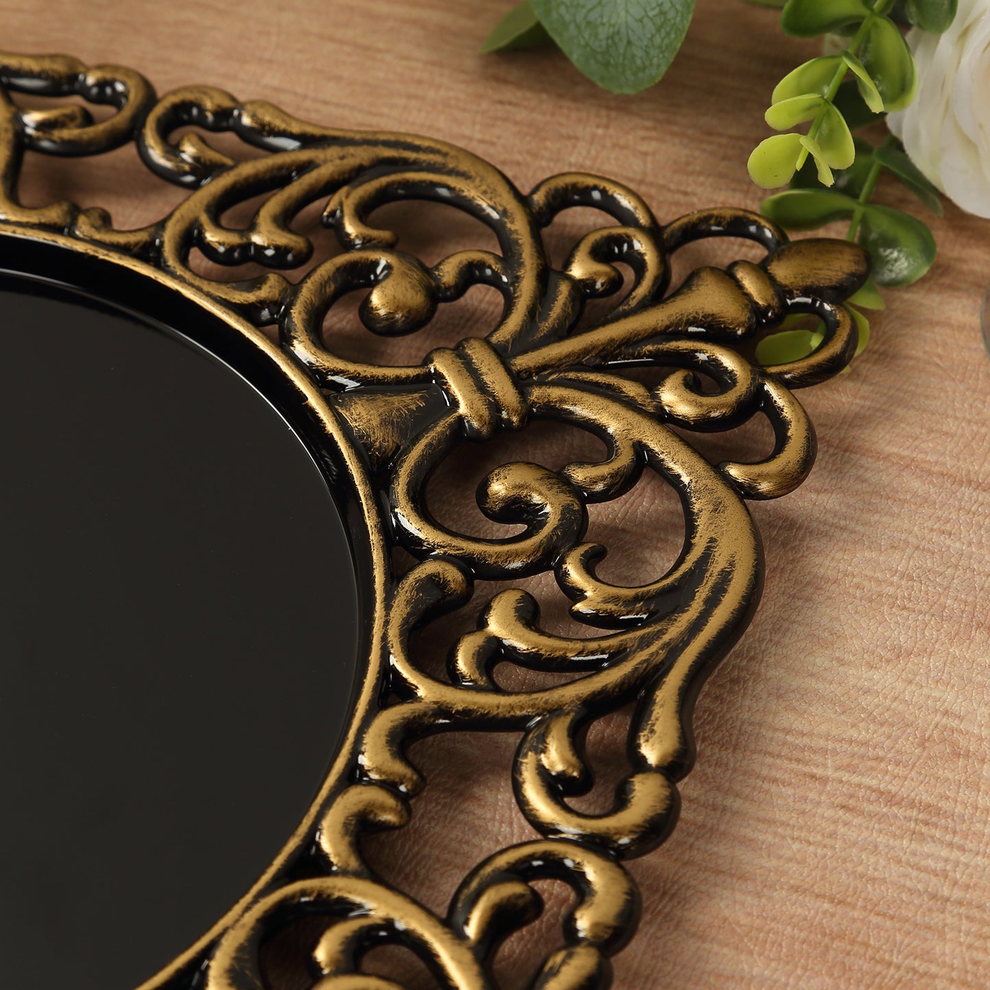 Black square acrylic charger plate with antique gold lace border.
