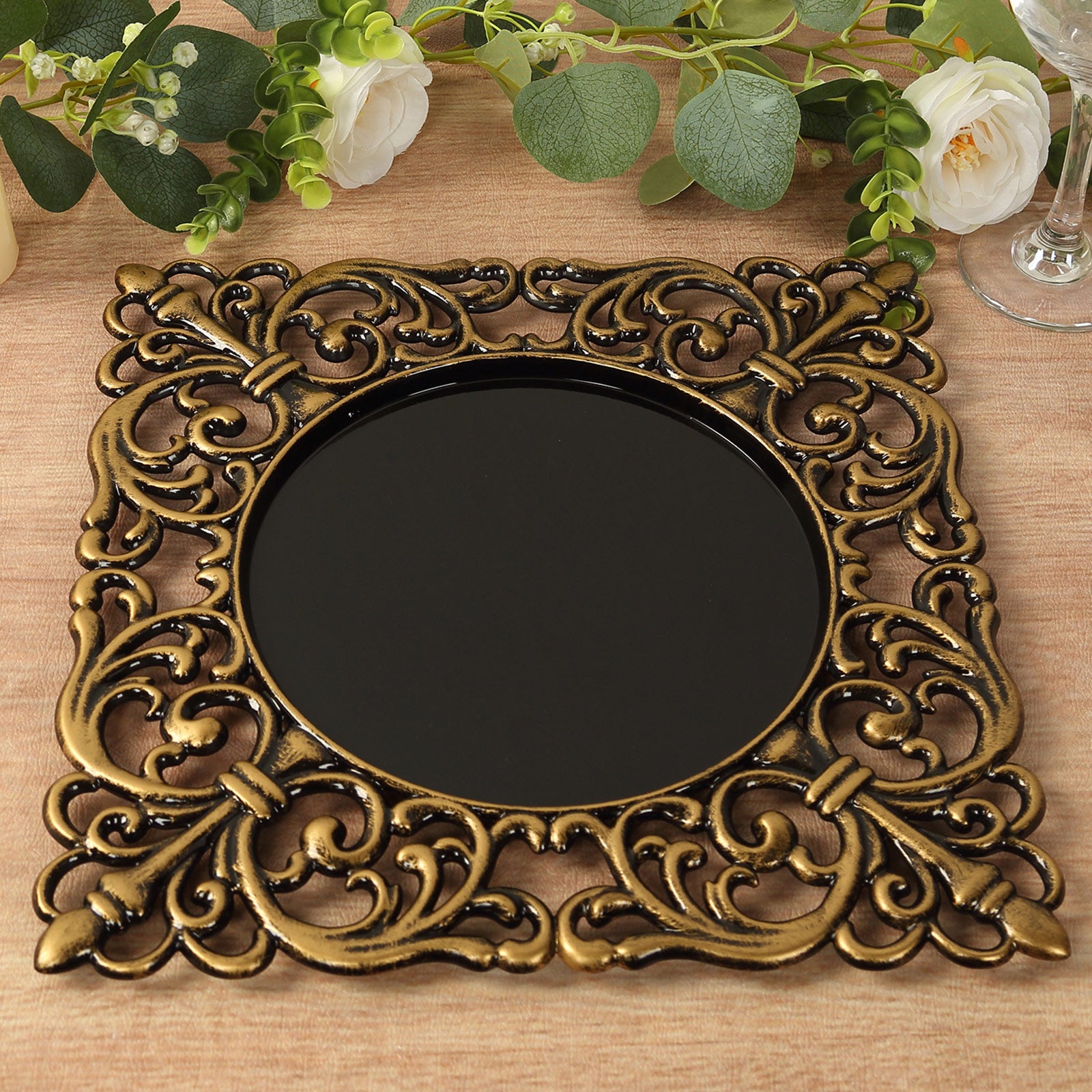 Black square acrylic charger plate with antique gold lace border.