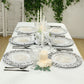 Antique white vintage floral charger plates for elegant tabletop decor.