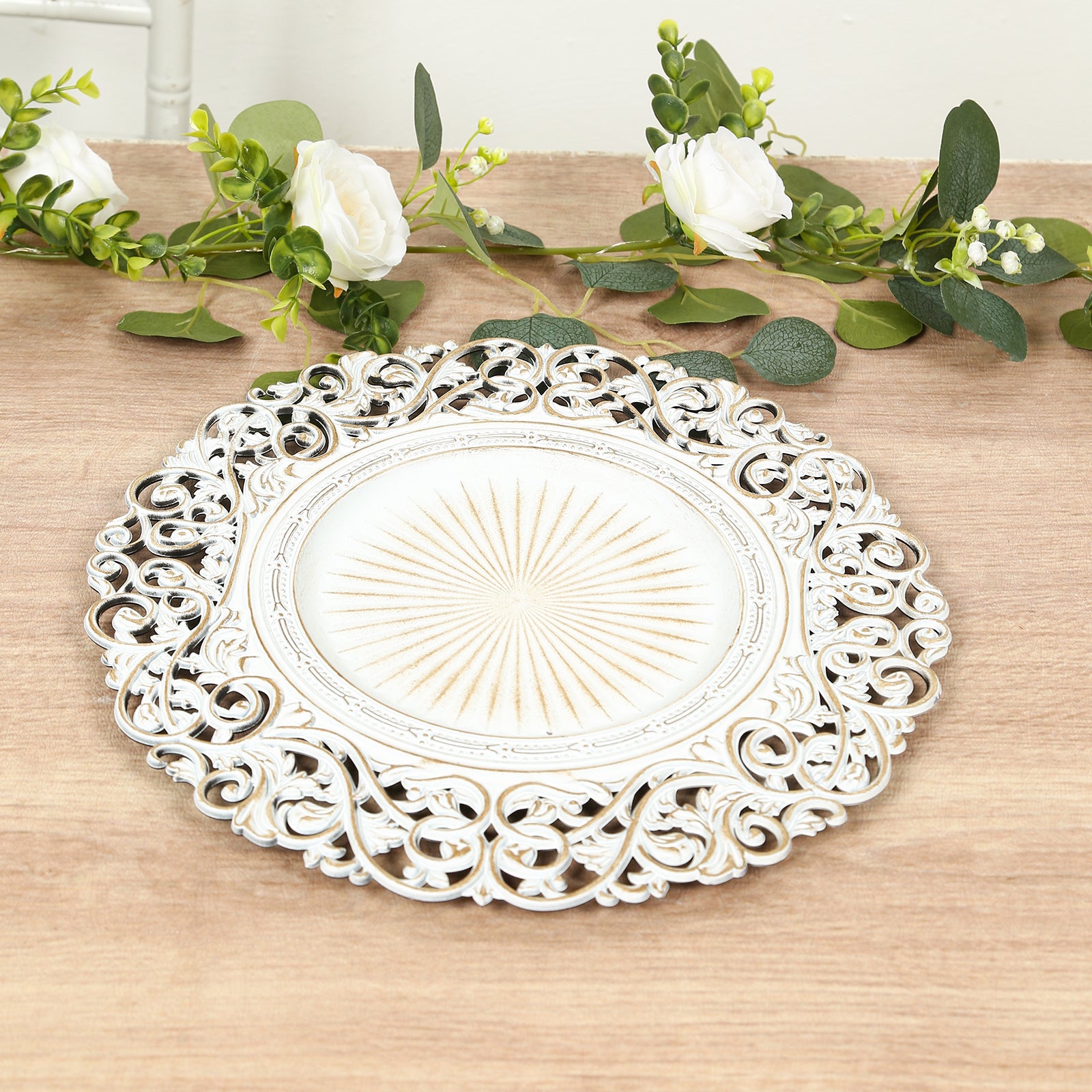 Antique white vintage floral charger plate with ornate carved rim.