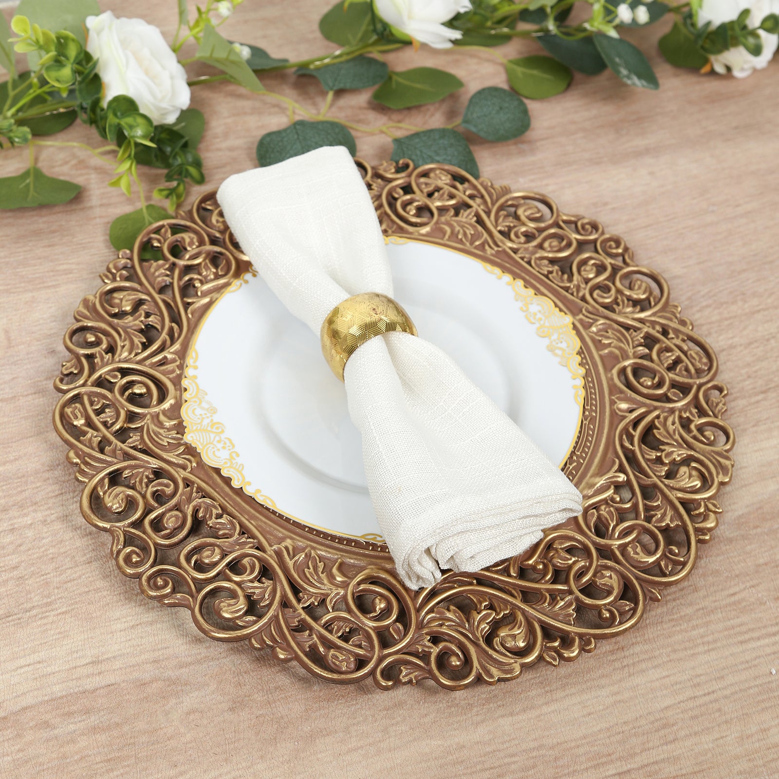 Brown charger plate with vintage floral carved rim and white napkin.
