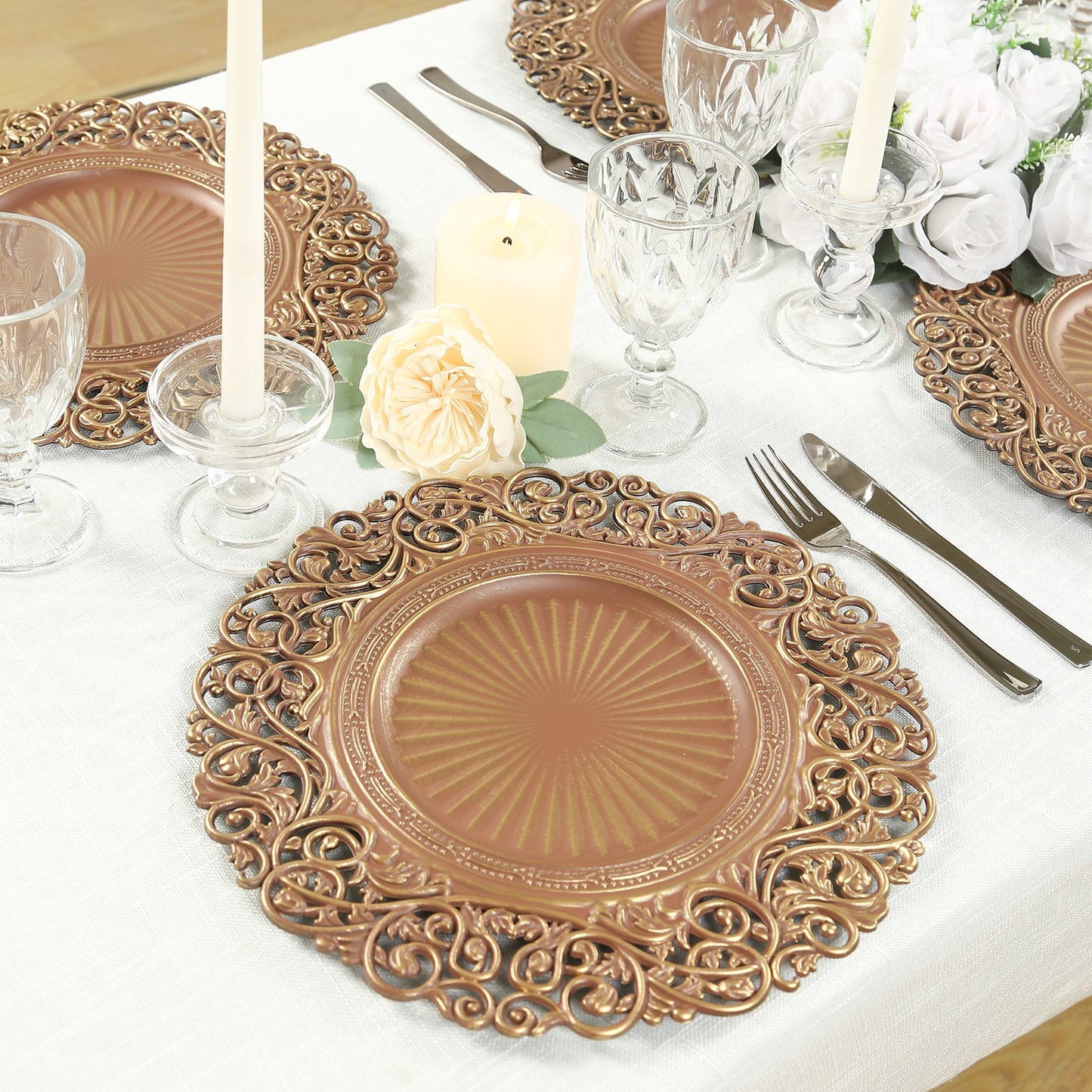 Brown charger plate with vintage floral design on an elegant table setting.